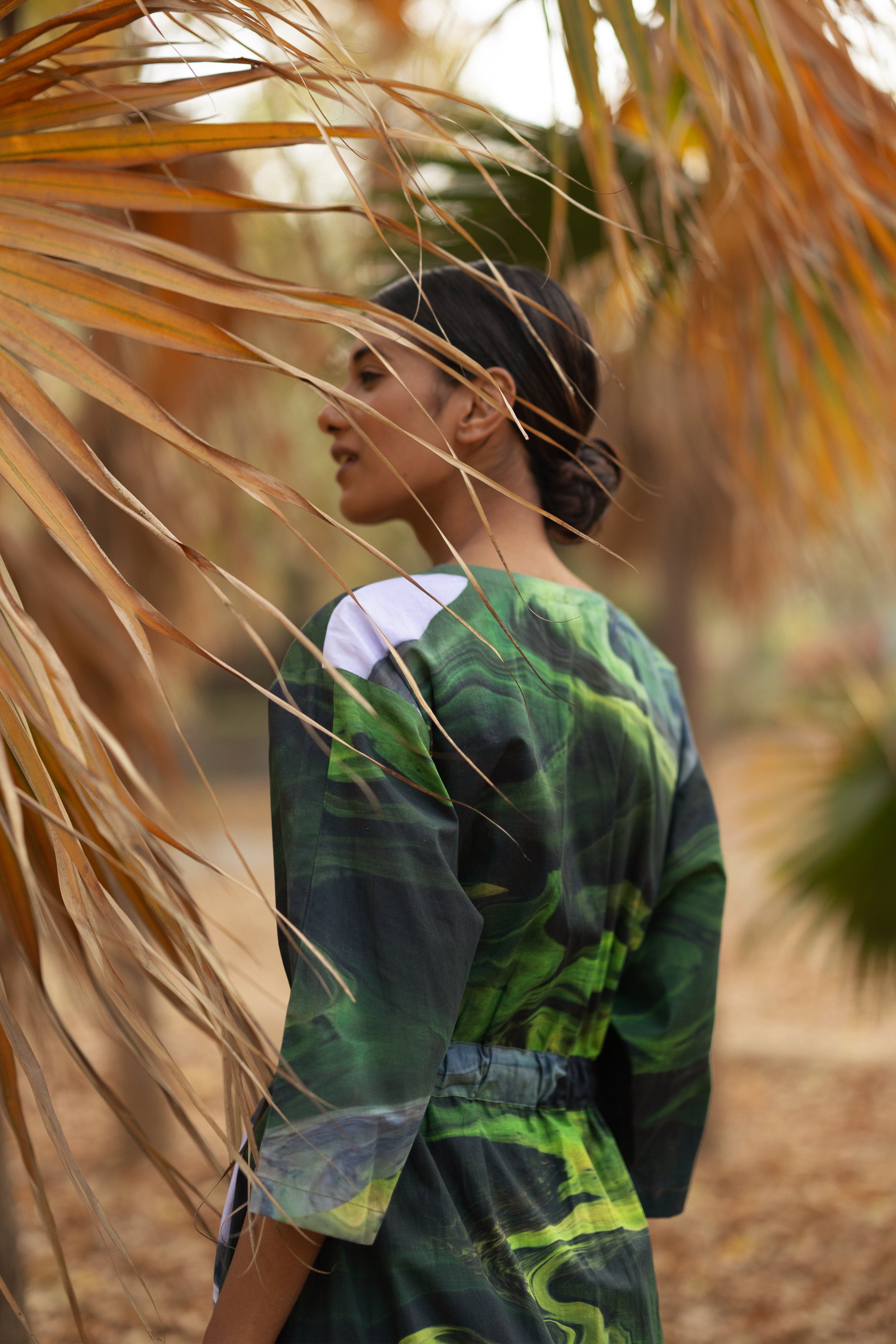 Doodlage Doris green dress with flowy fabric and long sleeves, stylish and comfortable for casual or semi-formal wear.