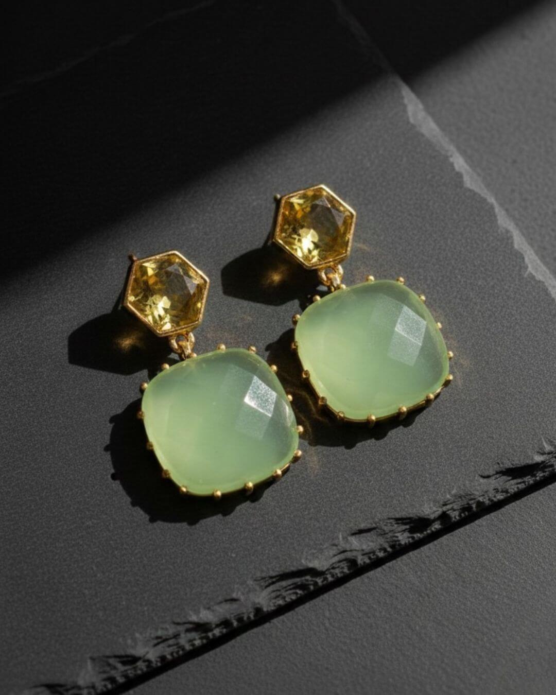 Ila blue earrings by Bombaybirds featuring vibrant blue gemstone dangles and gold-tone hooks for a stylish look.