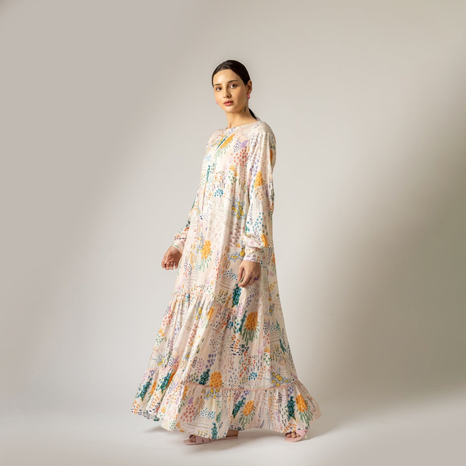 Doodlage Yayoi printed dress with colorful floral pattern, short sleeves, and knee-length fit on a mannequin.