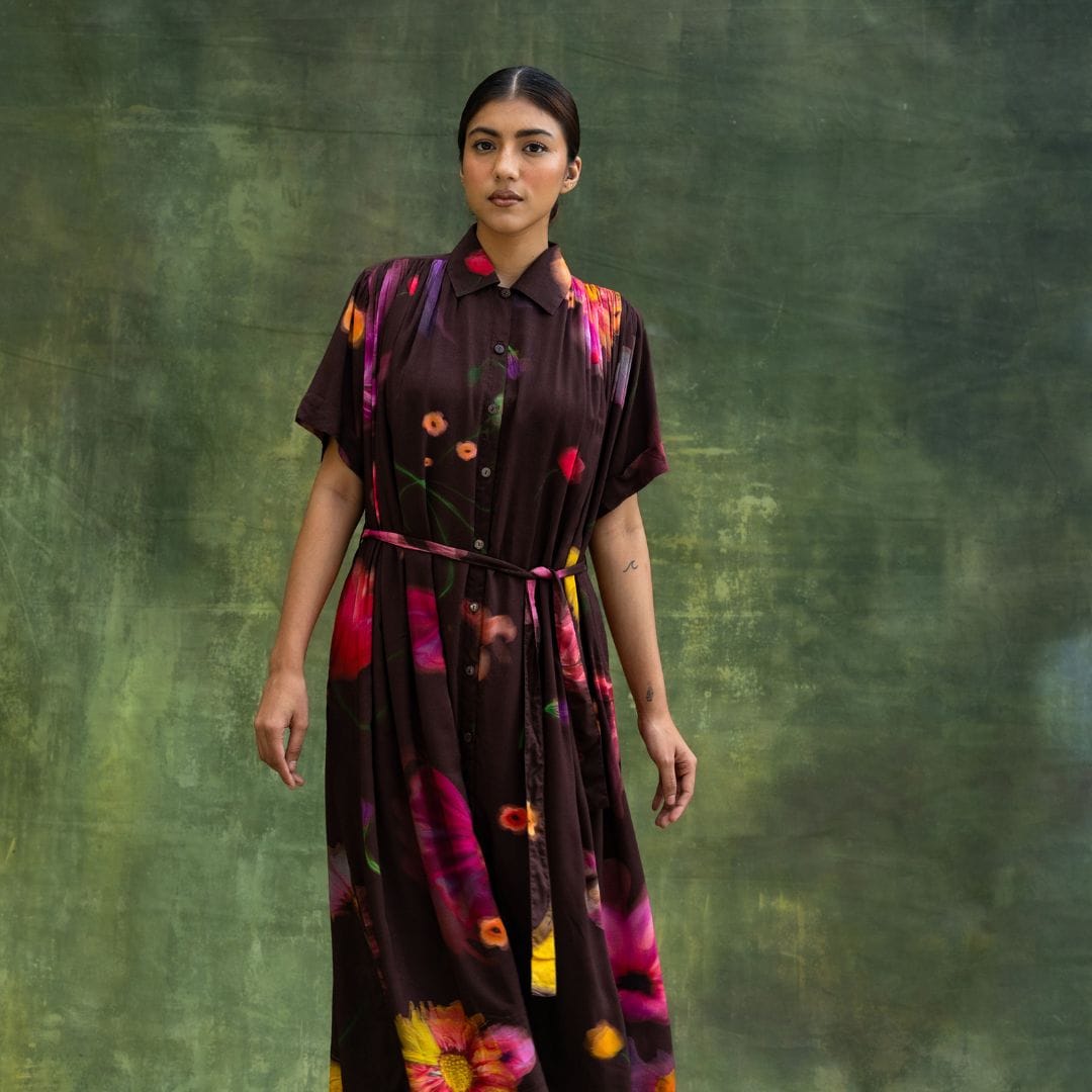 Doodlage Zora brown dress with long sleeves and a flowing silhouette, made from eco-friendly fabric, displayed on a mannequin.