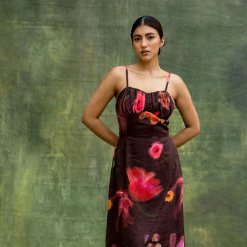 Doodlage Lucie printed dress with vibrant floral pattern, lightweight fabric, and casual fit displayed on a hanger.