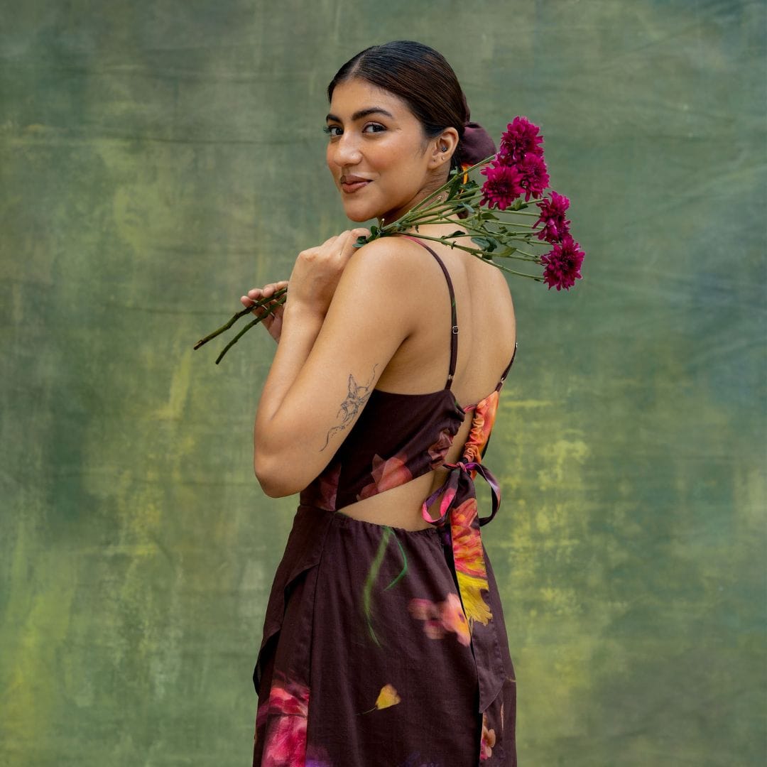 Doodlage Lucie printed dress with floral pattern, lightweight fabric, and feminine silhouette, shown on a hanger.