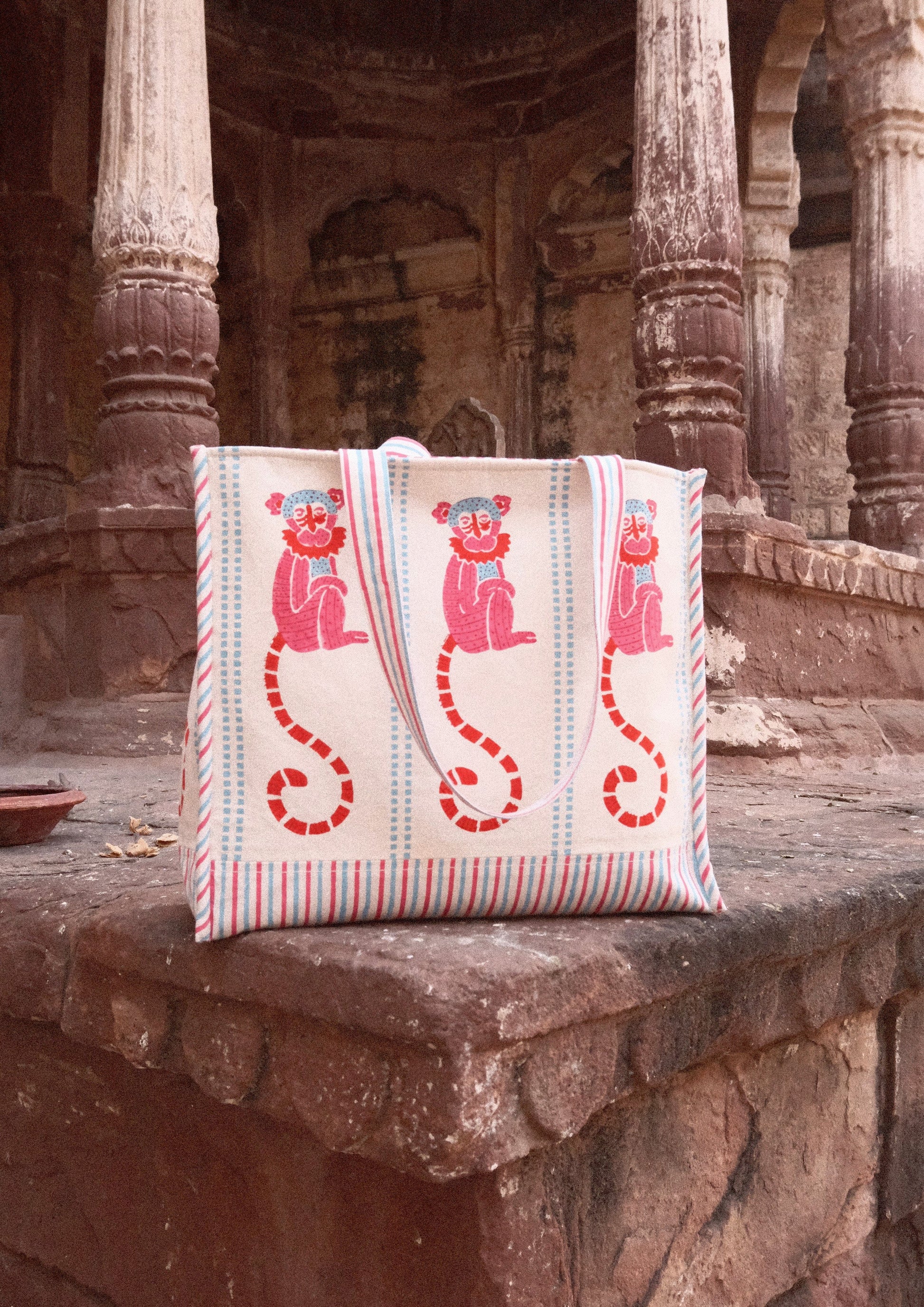 Funky monkey block print tote bag from The Raw India, casual reusable bag with vibrant monkey design and sturdy handles.