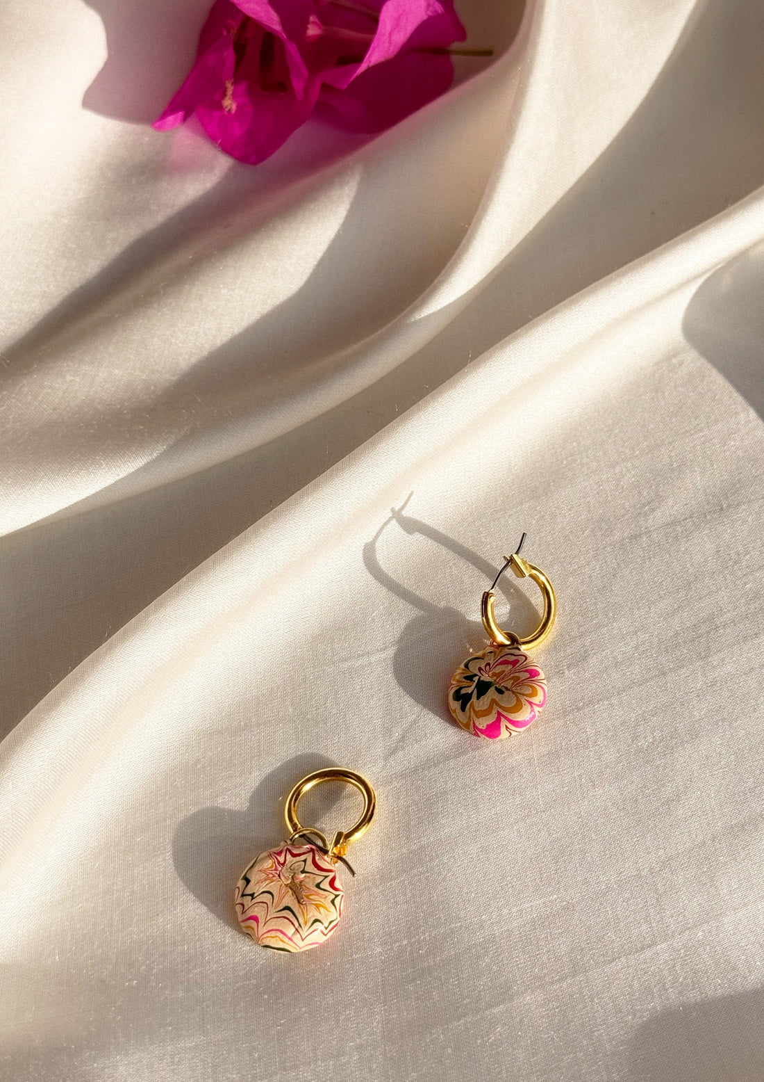 Small hoop earring from The Raw India featuring a delicate, minimalist gold jewelry design.