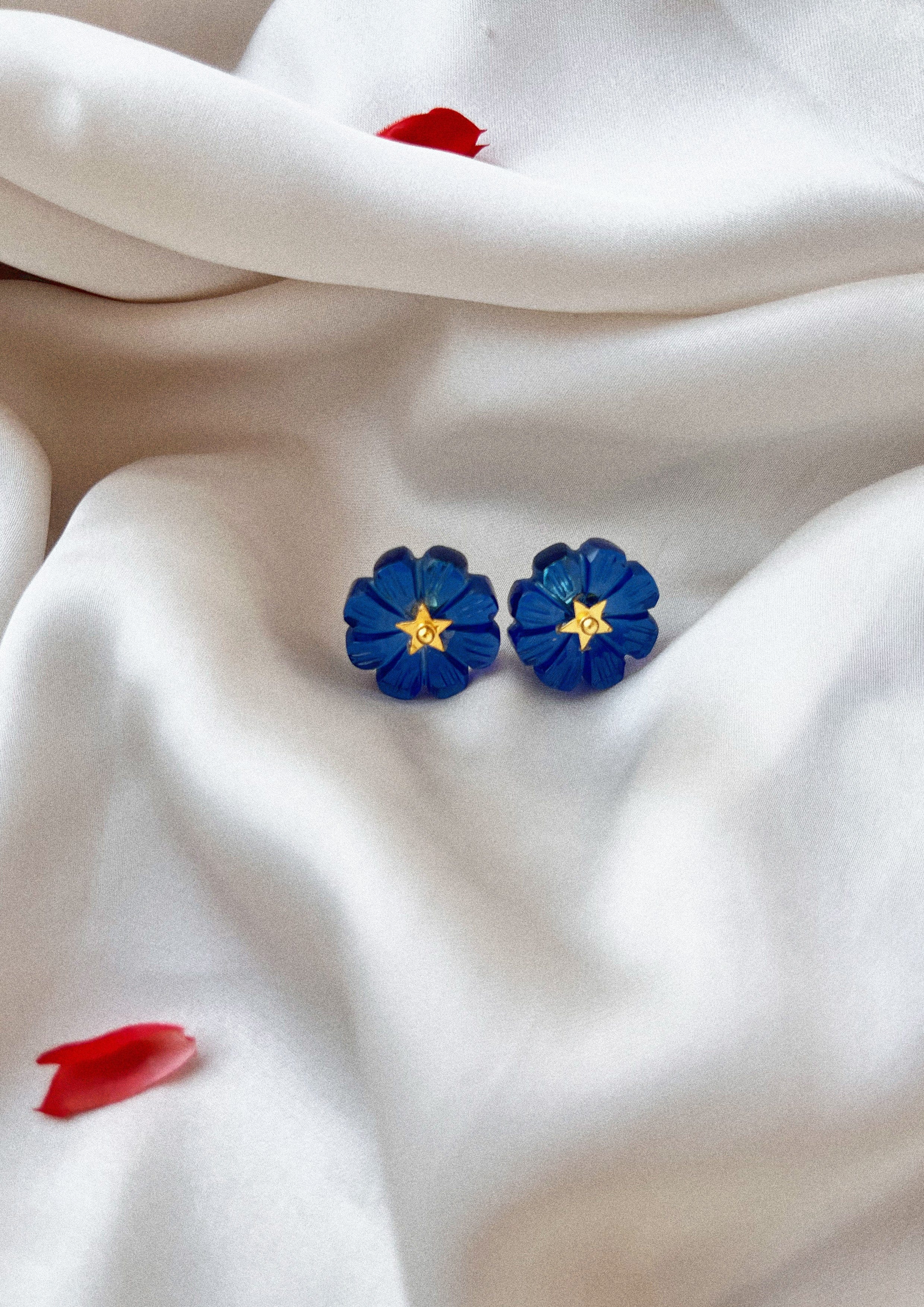 Blue quartz flower-shaped carved studs jewelry by The Raw India, showcasing delicate gemstone flower design on sterling silver posts.