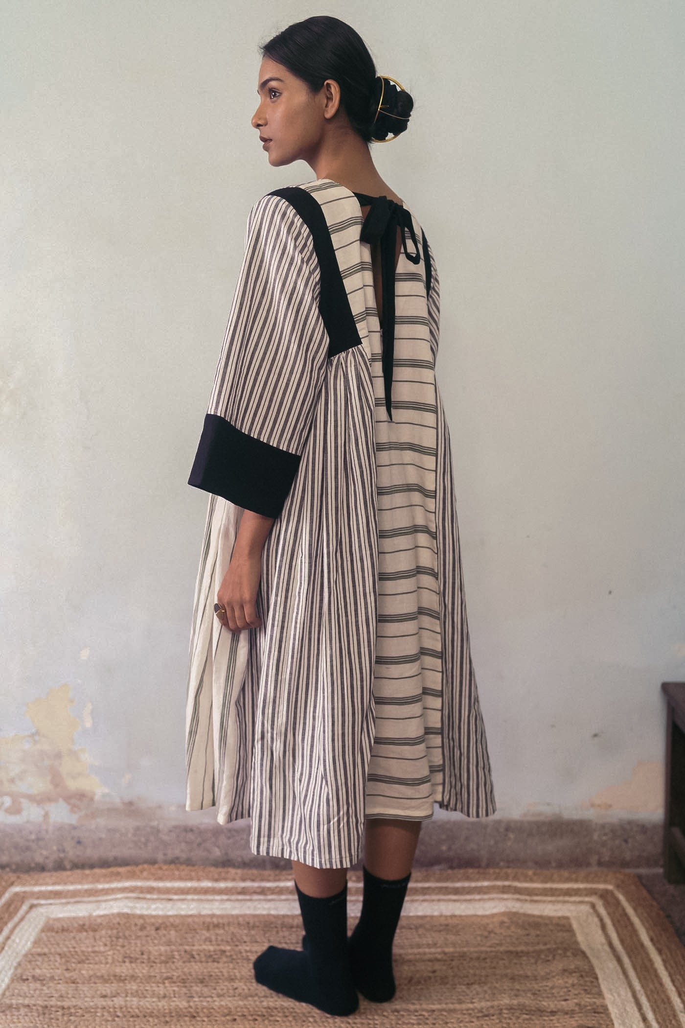 Deeta Shima dress featuring a stylish, flowy design with intricate patterns and vibrant colors, perfect for casual or semi-formal wear.