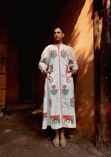 The Raw India Chaupad shirt dress in a vibrant mix print, featuring a relaxed fit and stylish collar design.