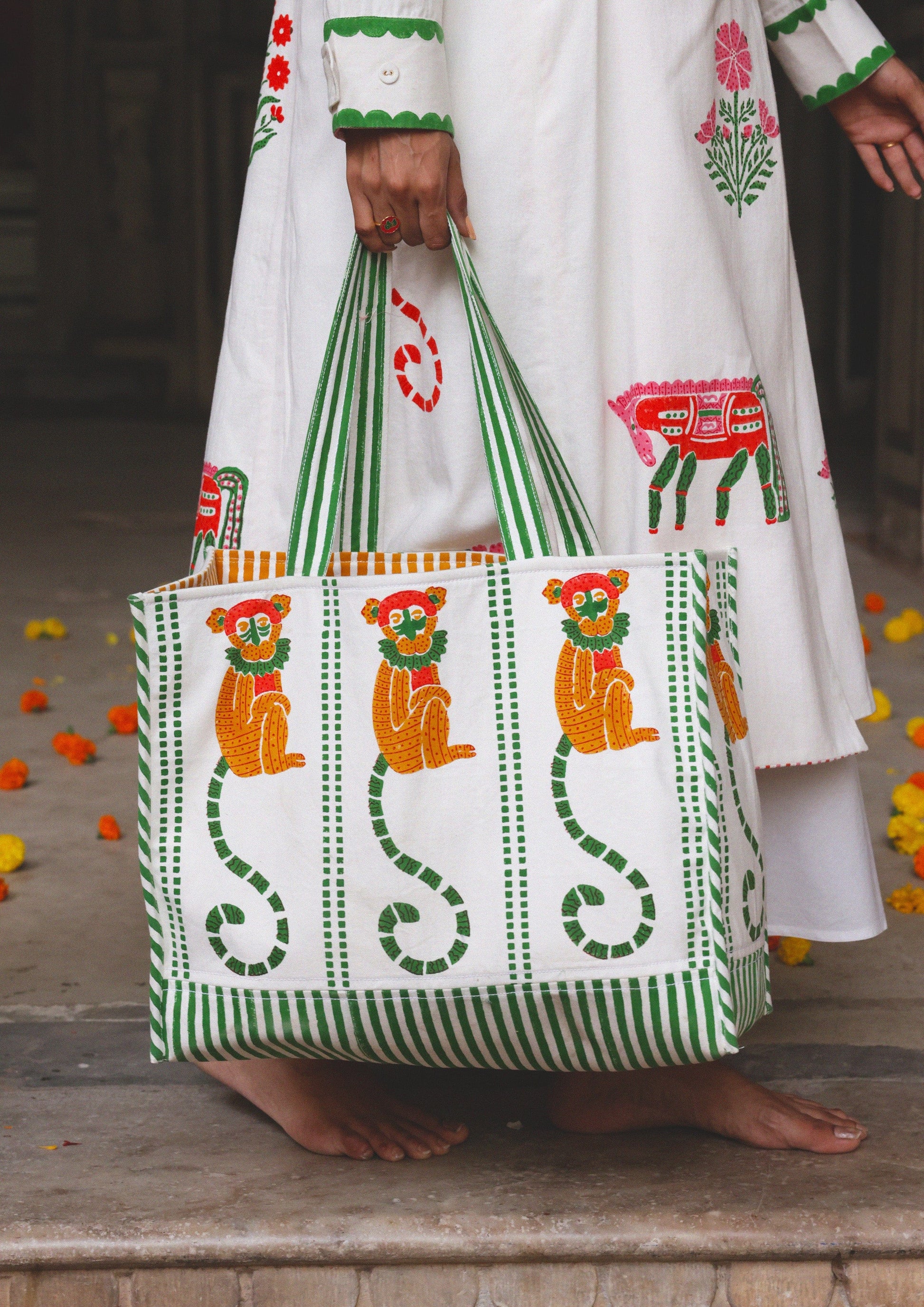 The Raw India tote bag featuring a playful monkey block print, made of eco-friendly fabric with sturdy handles.