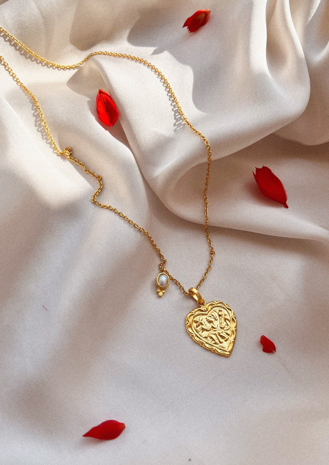 The Raw India heart-shaped accessory featuring intricate design, perfect for adding a stylish touch to traditional or modern outfits.