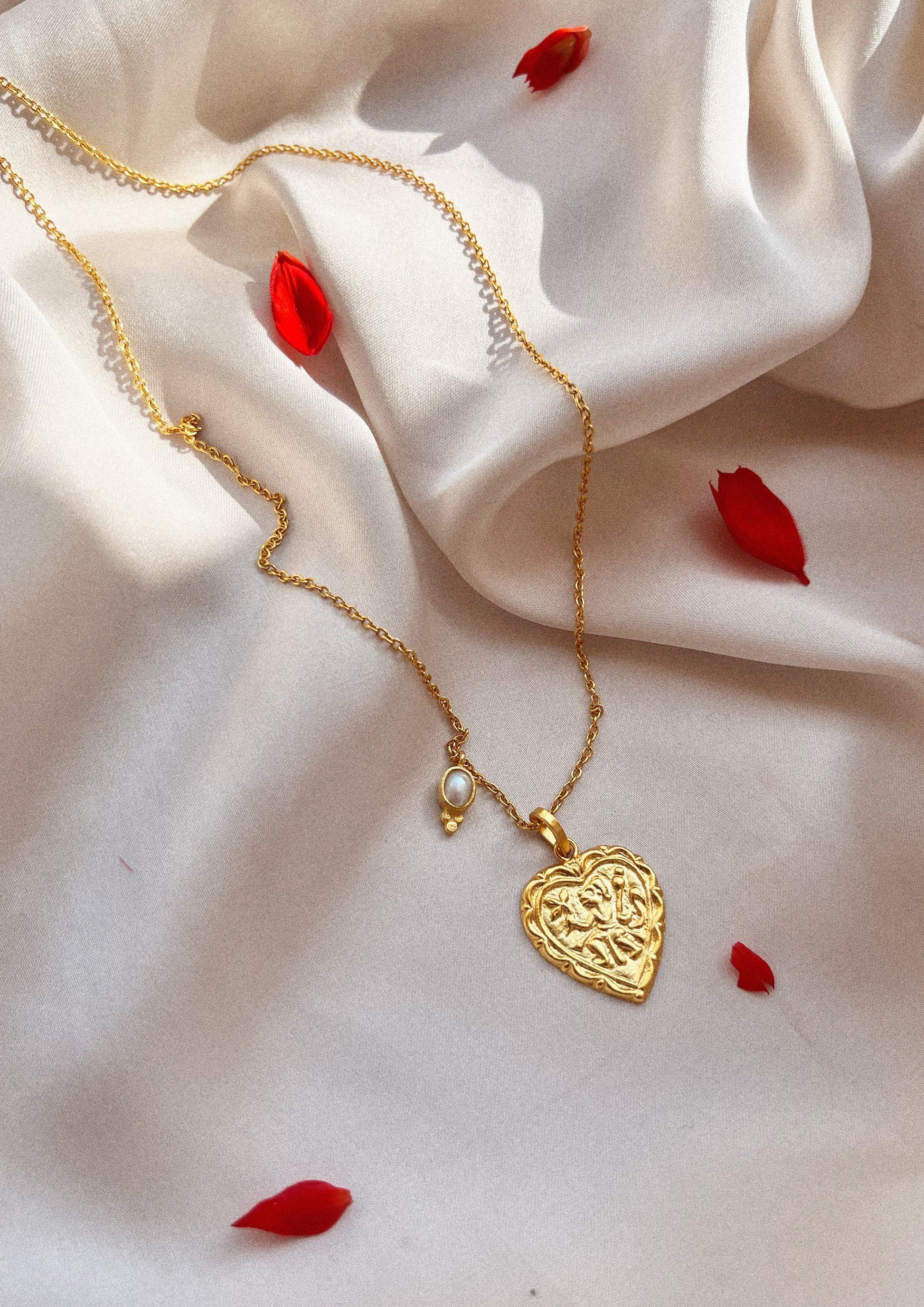 The Raw India heart-shaped accessory featuring intricate design, perfect for adding a stylish touch to traditional or modern outfits.