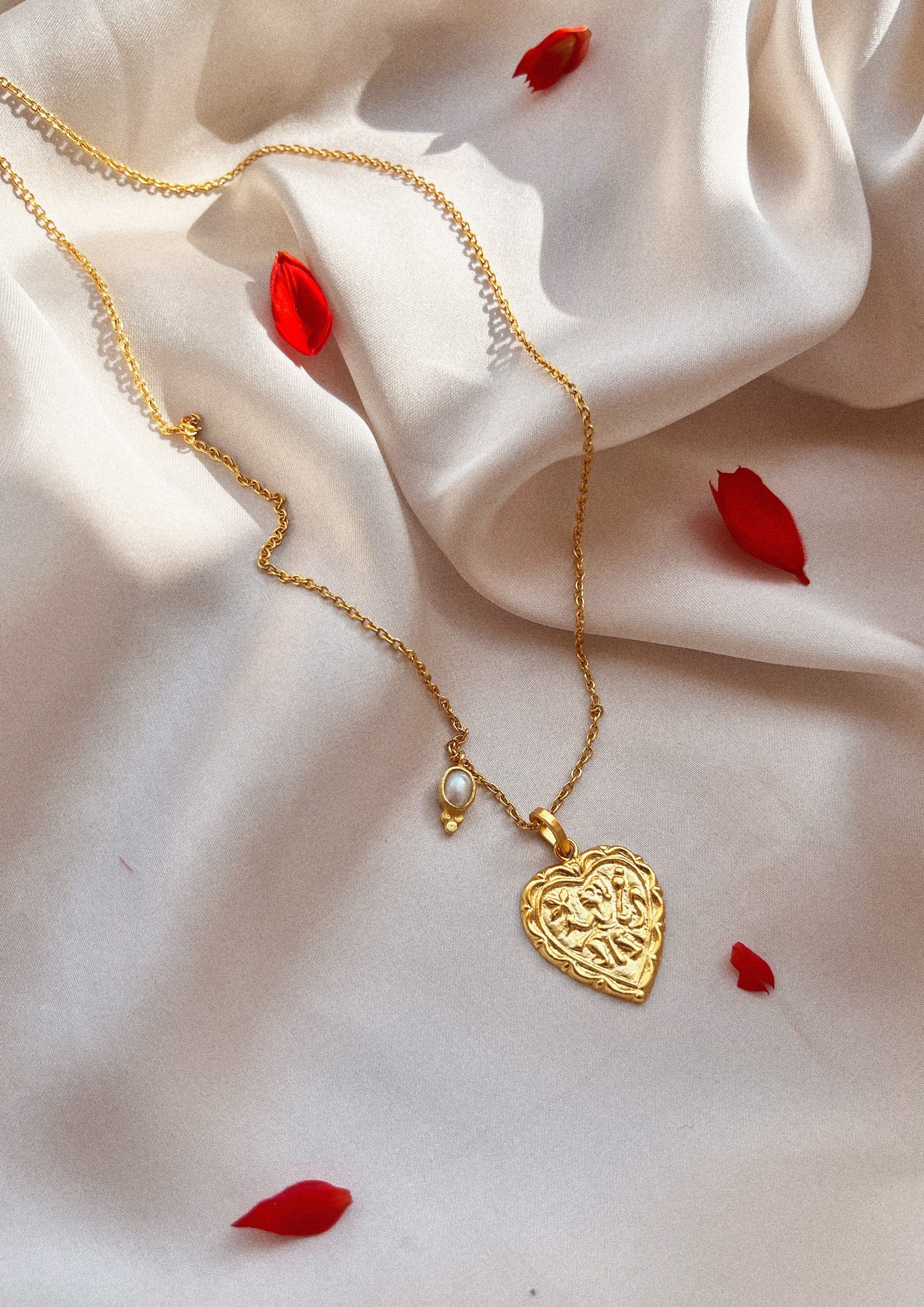 The Raw India heart-shaped accessory featuring intricate design, perfect for adding a stylish touch to traditional or modern outfits.