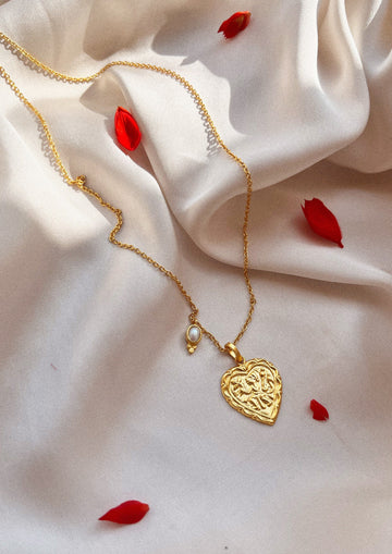 The Raw India heart-shaped accessory featuring intricate design, perfect for adding a stylish touch to traditional or modern outfits.