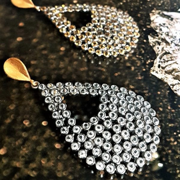 Bombaybirds Ofelia earrings showing gold-tone hoops with intricate detailing and elegant design on a white background.