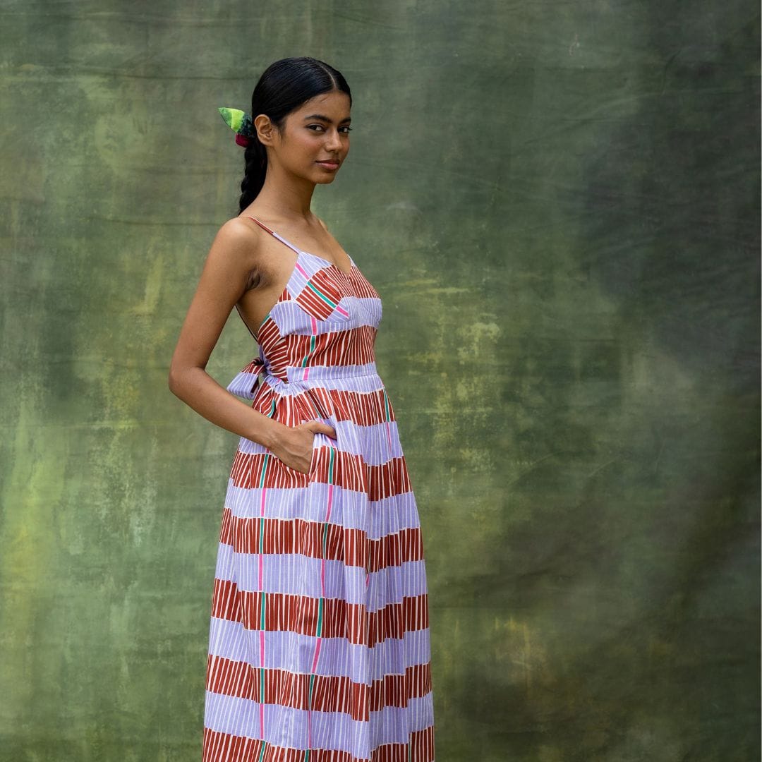 Doodlage Mary striped dress featuring colorful horizontal stripes, sleeveless design, and a relaxed fit on a mannequin.