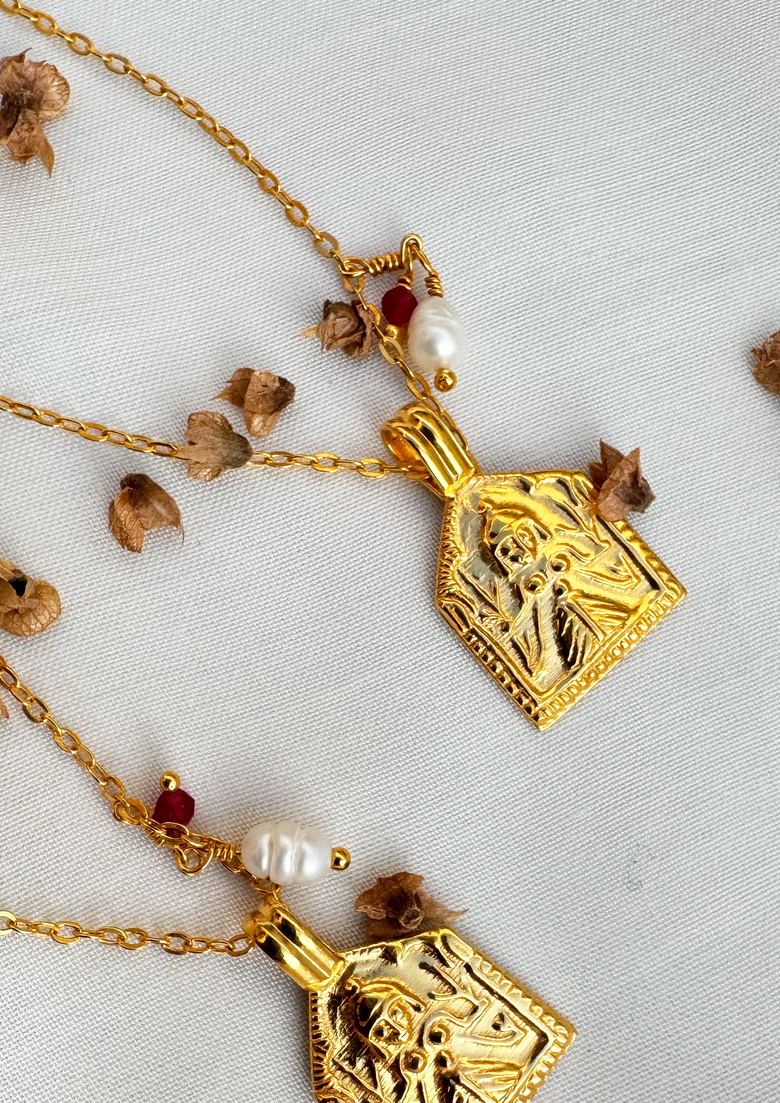 Silver goddess paatri accessory by The Raw India with intricate traditional design, displayed on a neutral background.