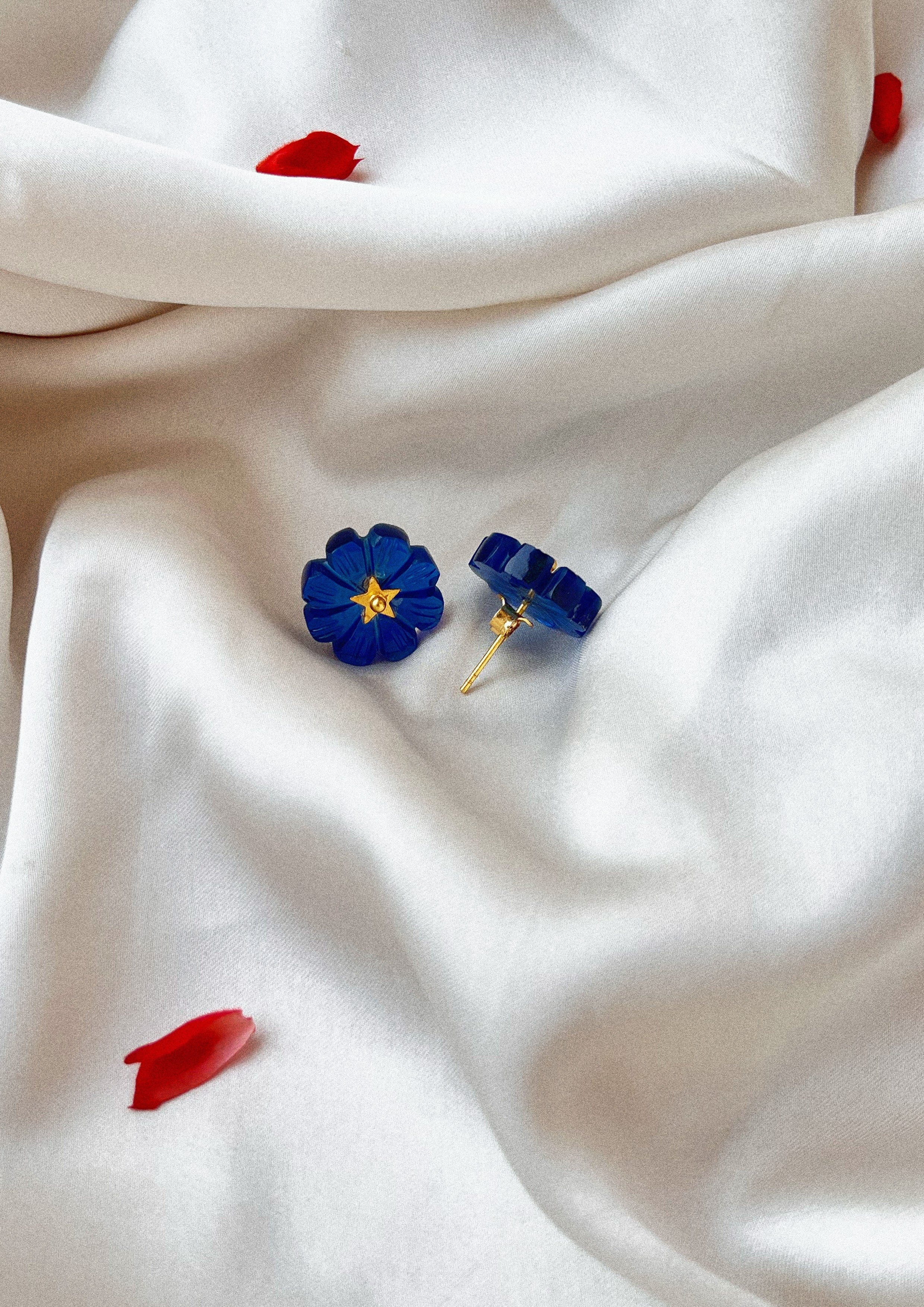 Blue quartz carved flower studs from The Raw India jewelry collection, showcasing intricate floral design and vibrant gemstone details.