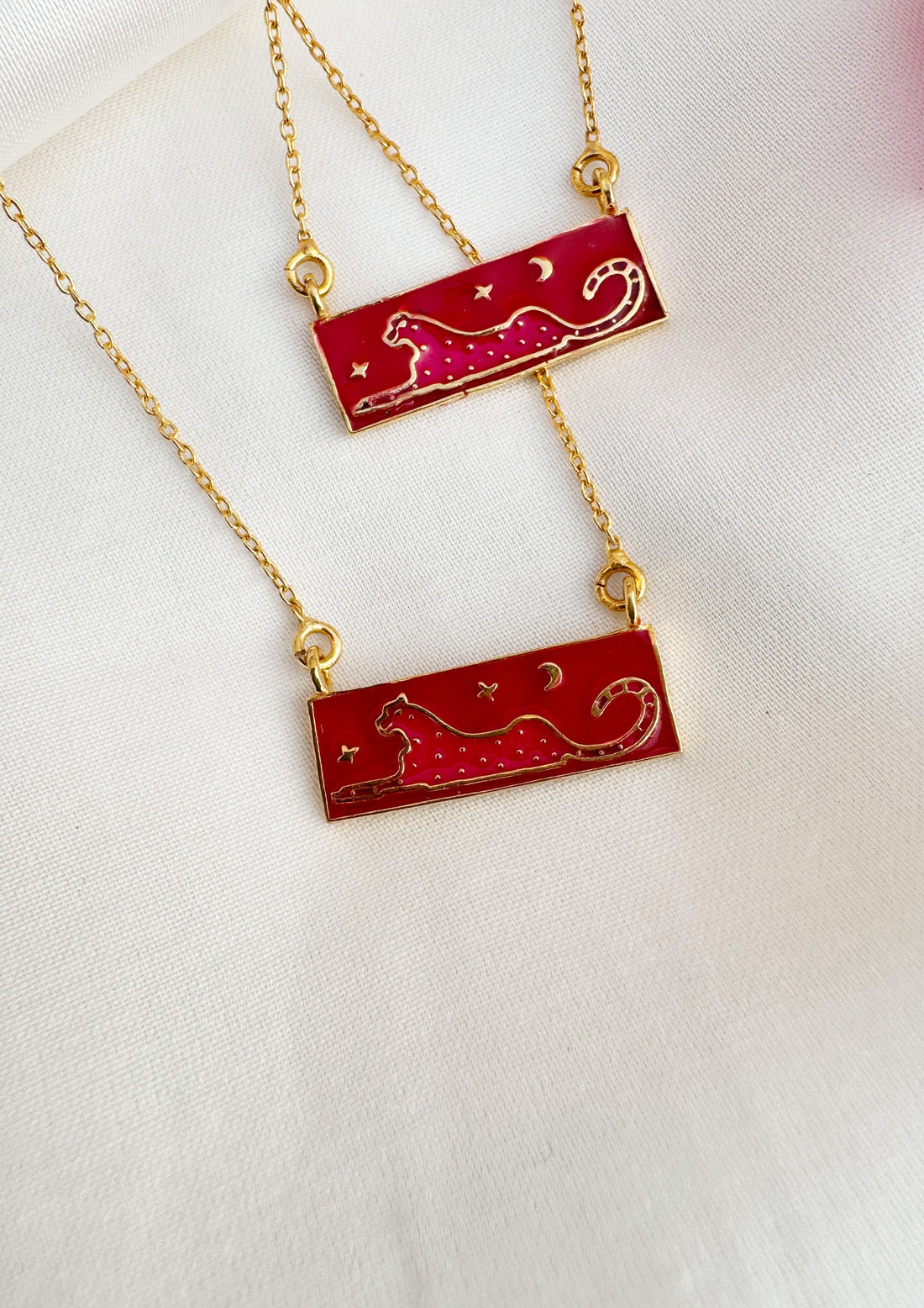 Pink leopard meenakari pendant from The Raw India jewelry featuring intricate enamel work and vibrant design.