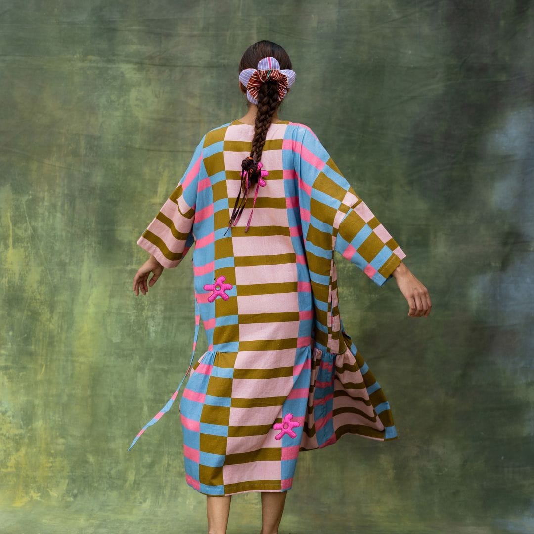 Doodlage Edith striped dress with long sleeves, knee-length, featuring colorful vertical stripes on lightweight fabric.