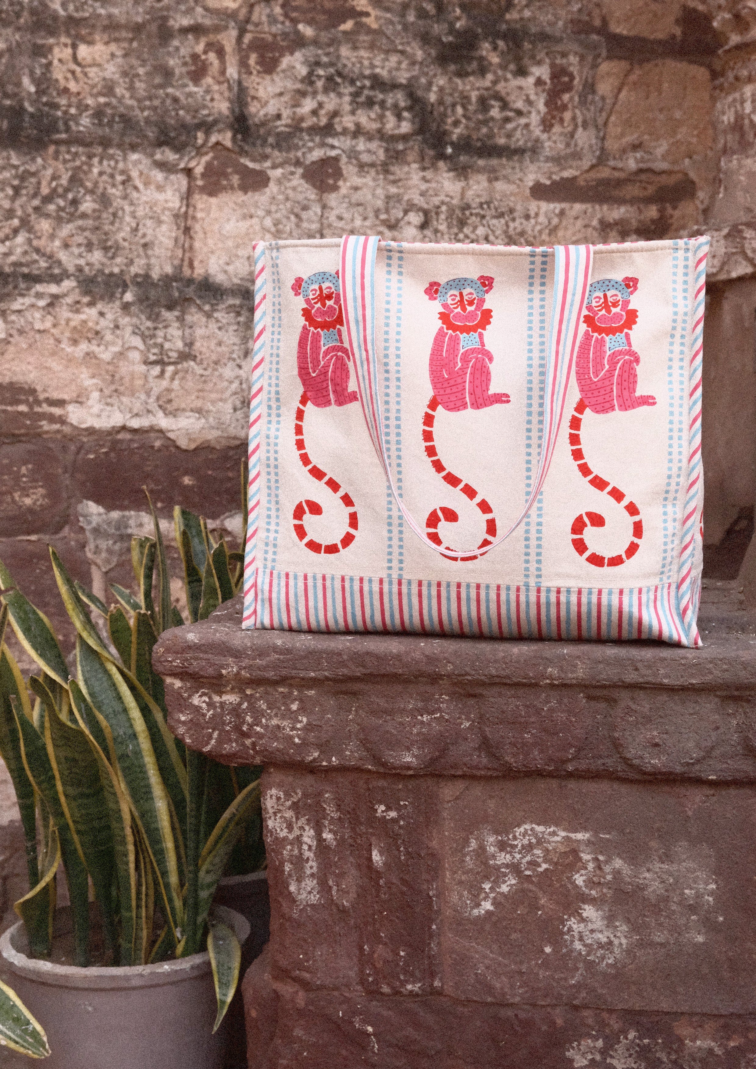 Colorful tote bag with funky monkey block print from The Raw India, made of durable fabric, perfect for casual or shopping use.