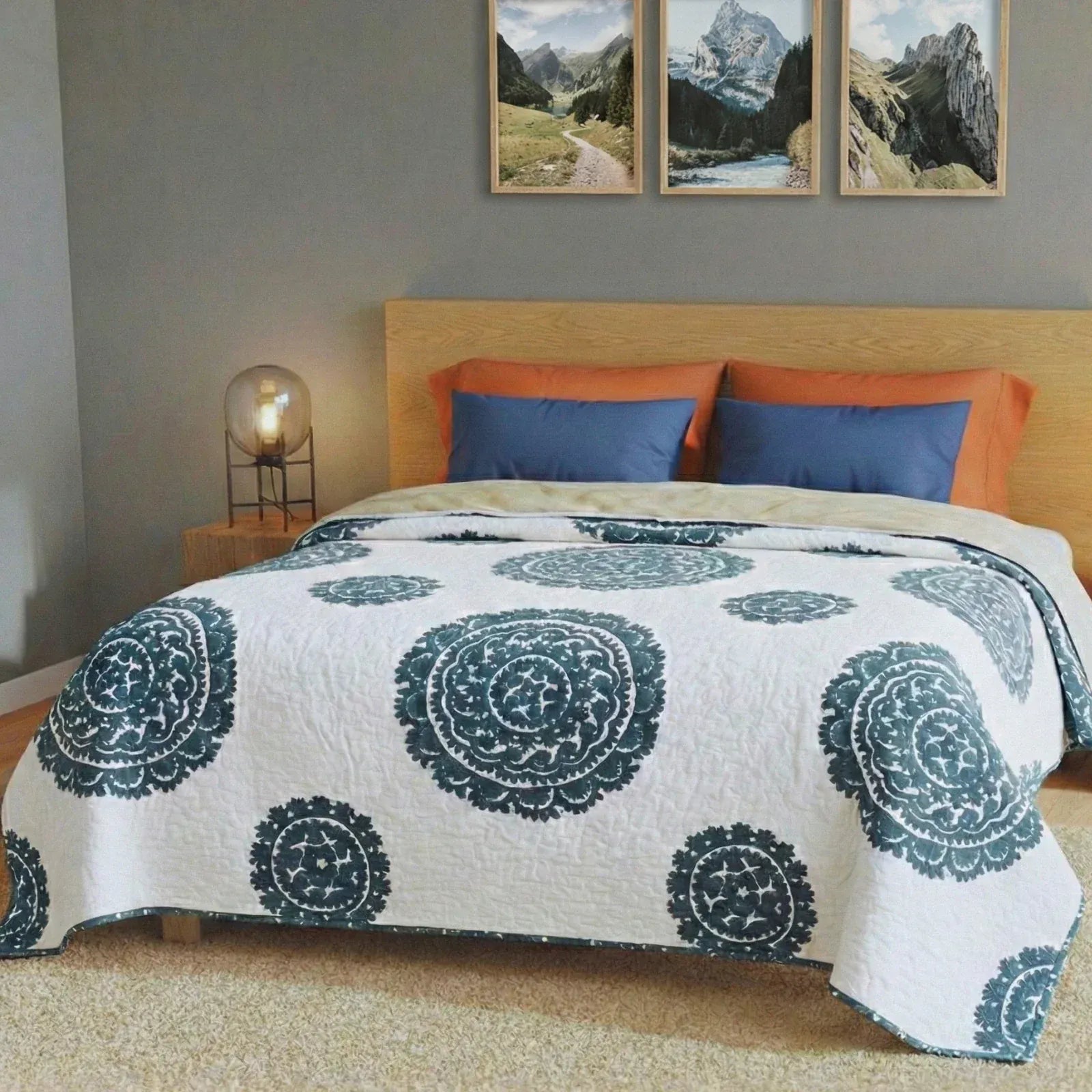Grey Suzani quilt from Bombaybirds, a stylish living room accent with intricate traditional patterns and soft fabric.