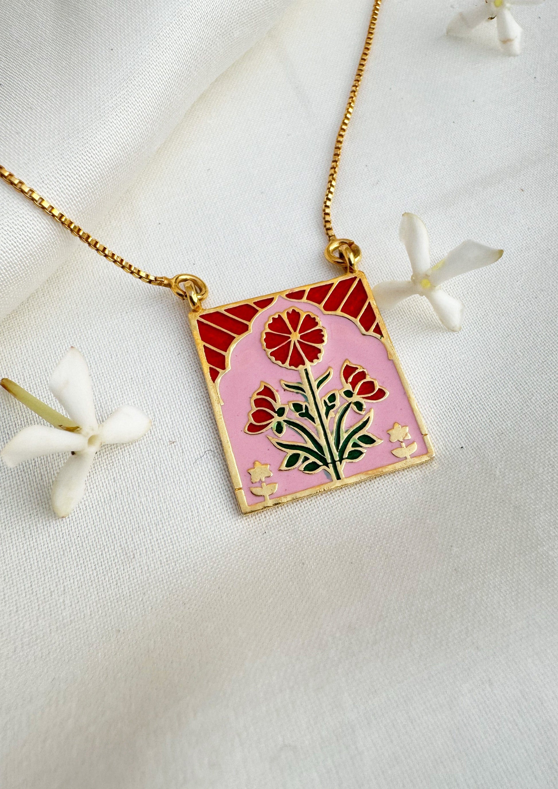 Red Buta meenakari pendant jewelry featuring intricate traditional design, crafted by The Raw India.