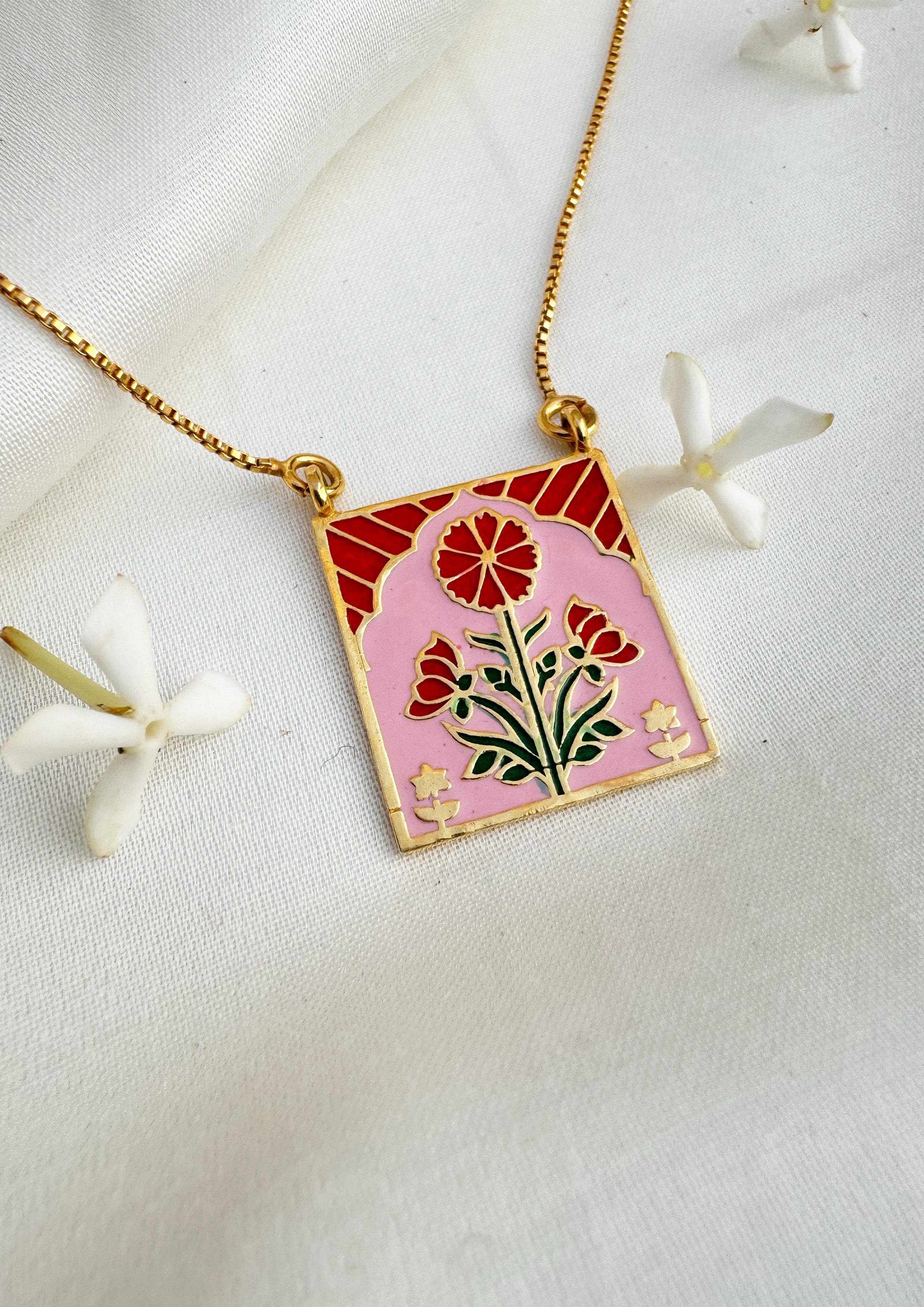 Red Buta meenakari pendant jewelry featuring intricate traditional design, crafted by The Raw India.