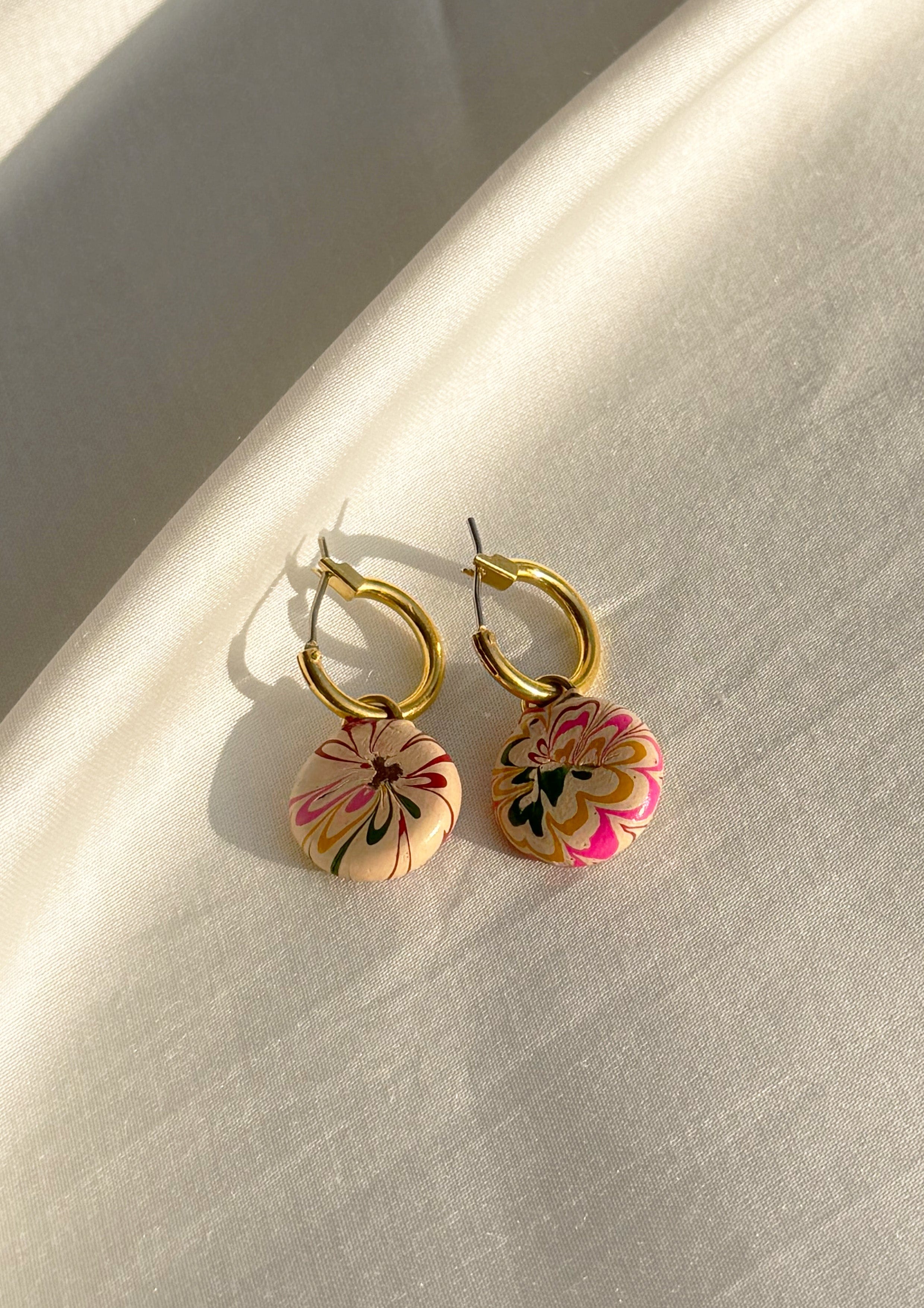 Small hoop earring from The Raw India, delicate gold jewelry hoop for stylish ear accessories.