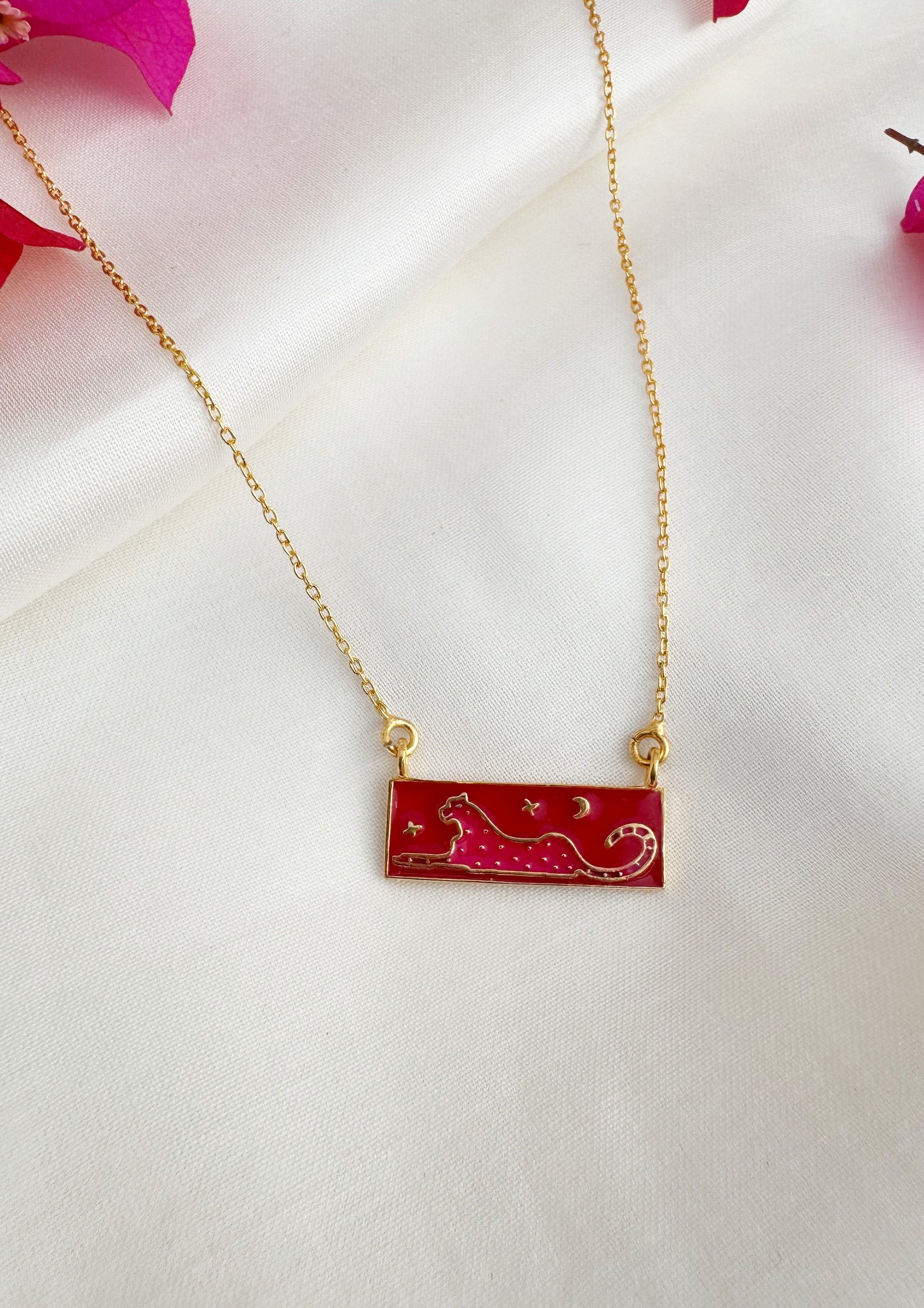 Pink leopard meenakari pendant jewelry by The Raw India showing intricate meenakari design and vibrant pink and gold details.