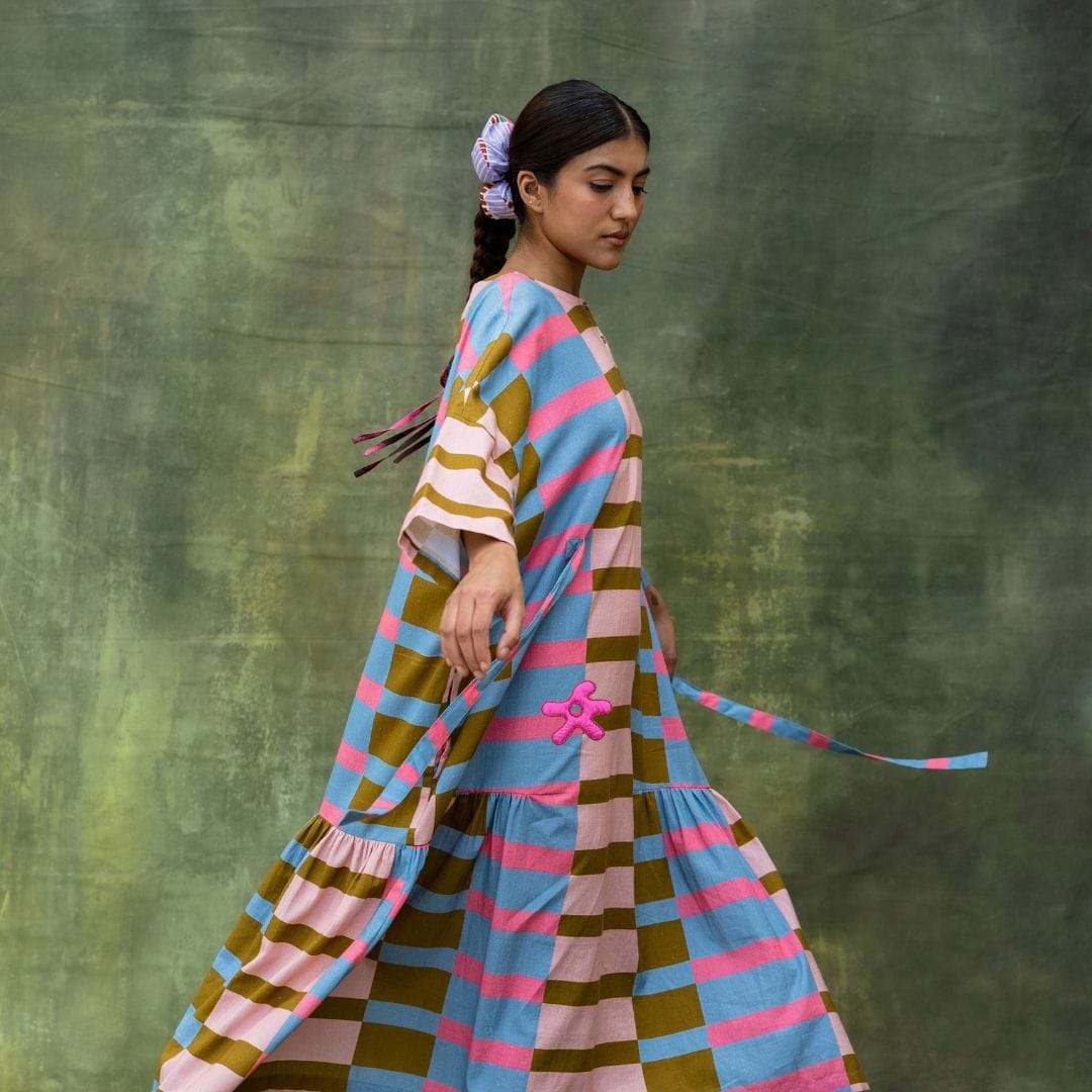 Doodlage Edith striped dress featuring a fitted silhouette, with colorful horizontal stripes and short sleeves.