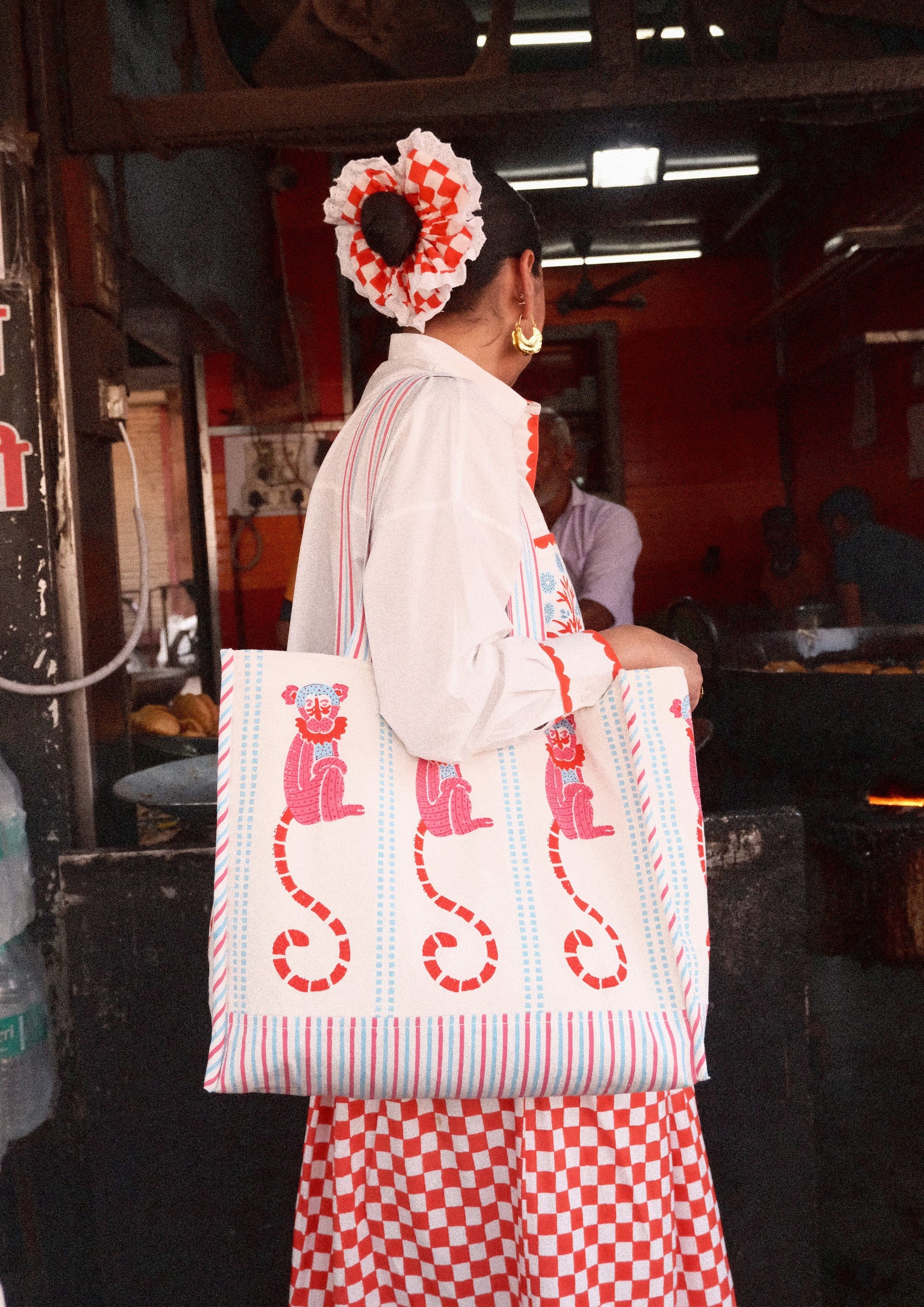 Funky monkey block print tote bag by The Raw India, colorful fabric bag with playful monkey design and sturdy handles.
