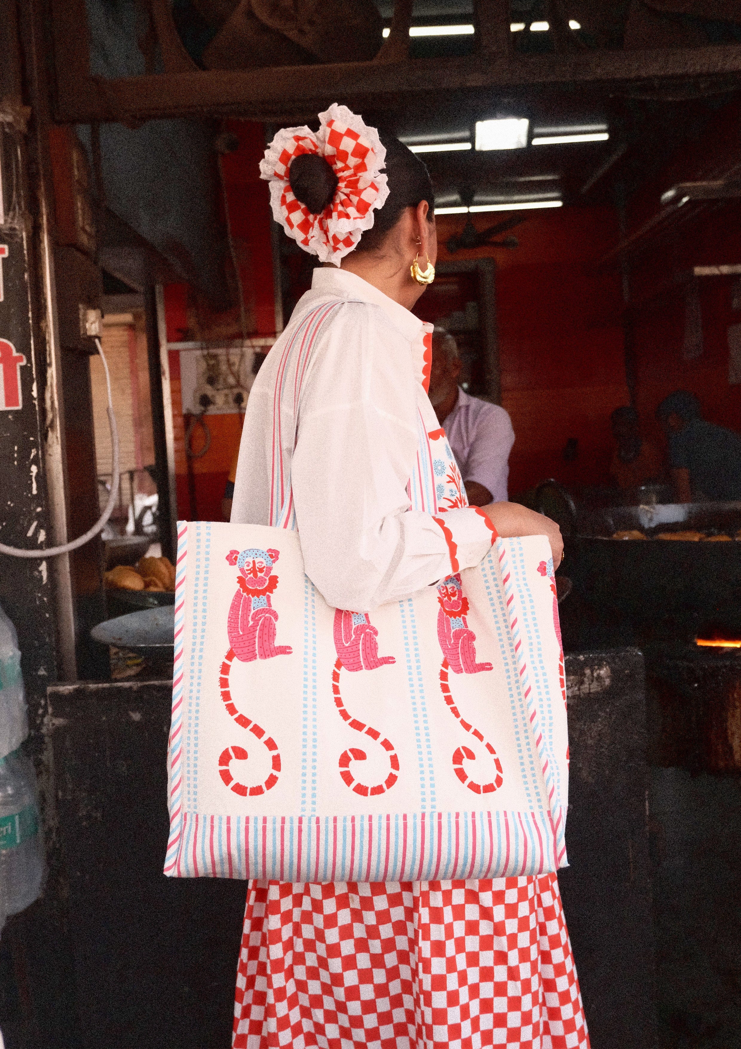 Funky monkey block print tote bag by The Raw India, colorful fabric bag with playful monkey design and sturdy handles.