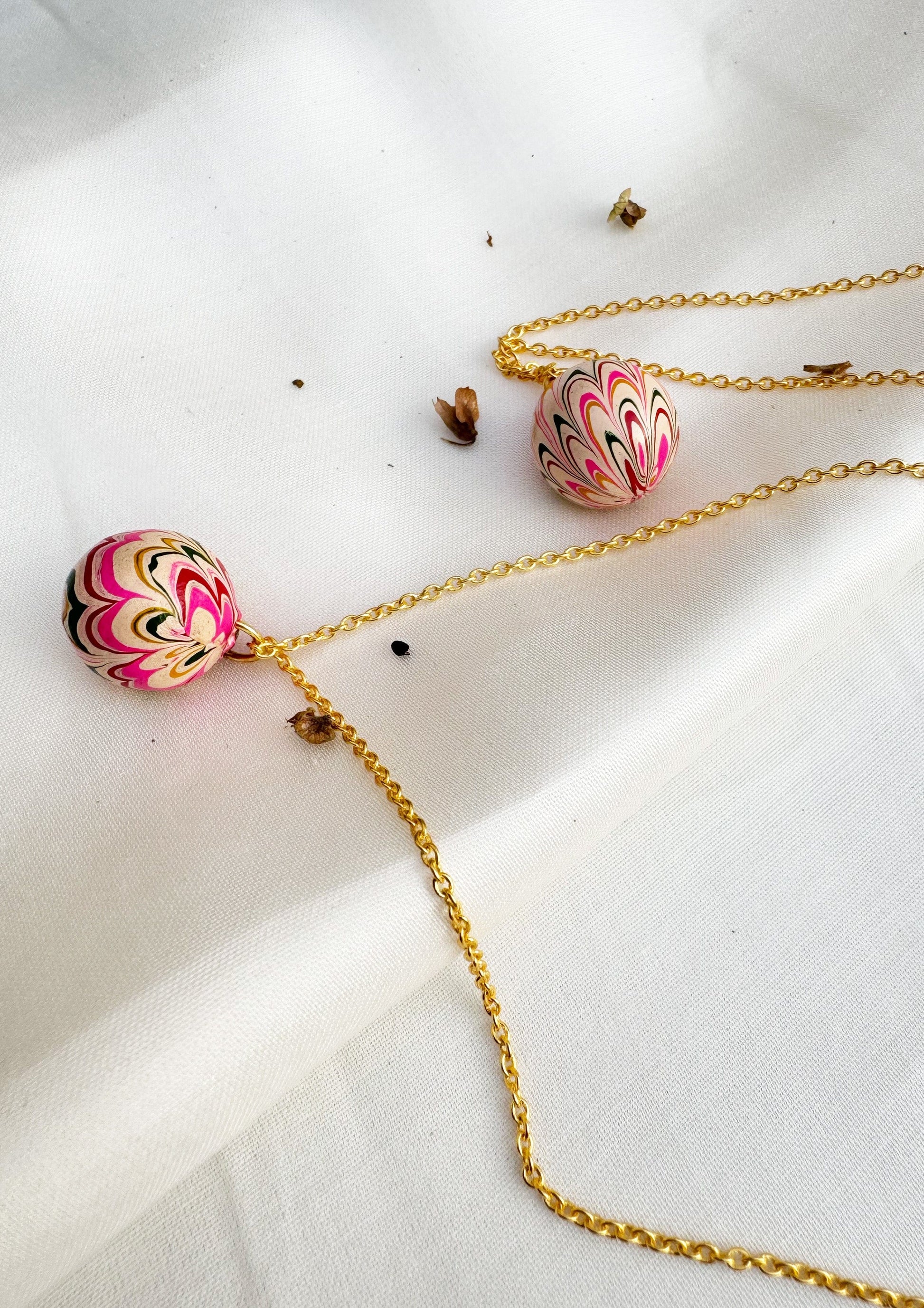 Gold Lac pendant jewelry by The Raw India featuring intricate traditional design and polished finish.