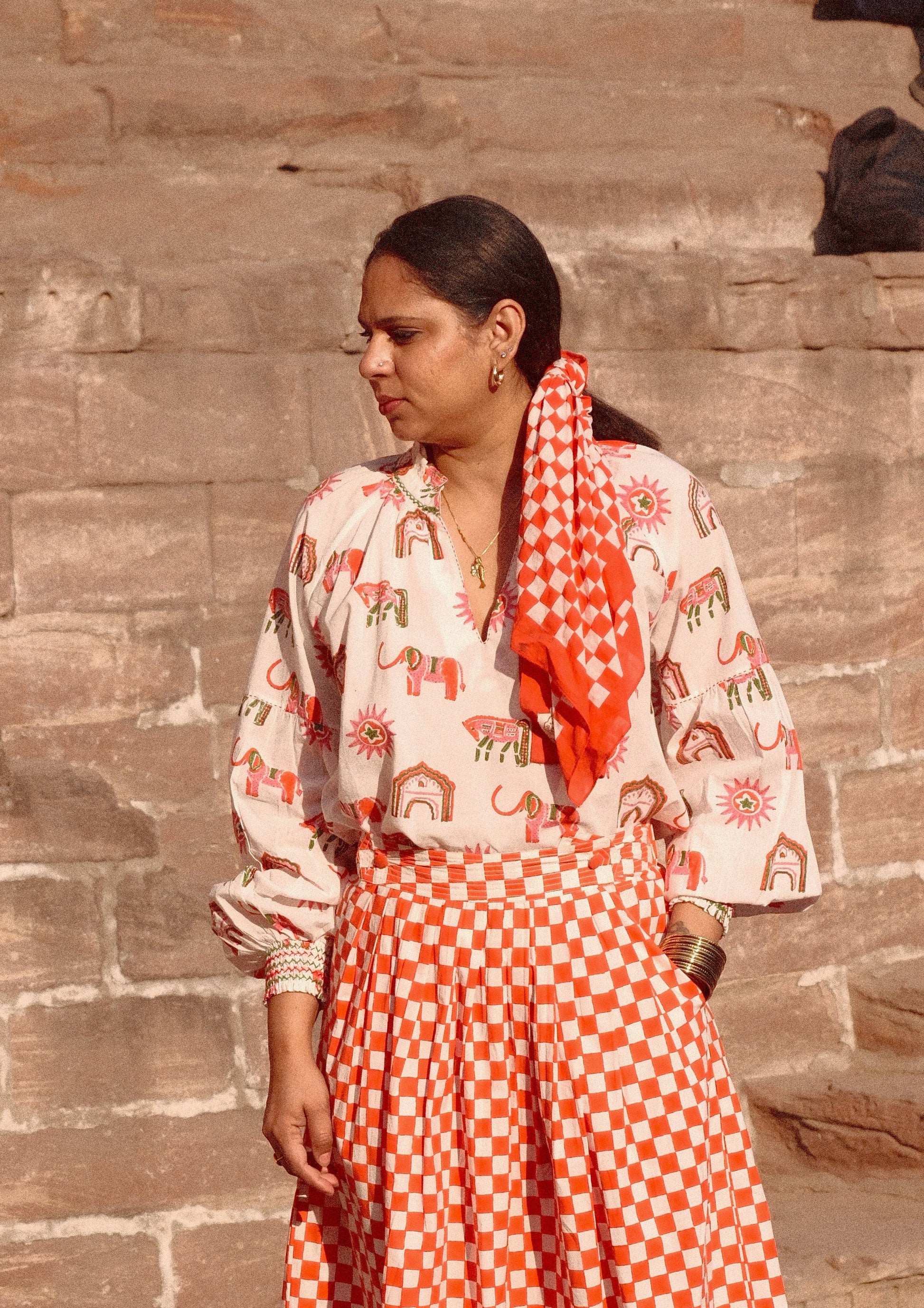Blossom Jaipur mix Mahal blouse from The Raw India, featuring vibrant floral patterns and lightweight fabric, perfect for casual wear.