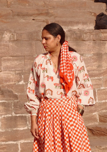 Blossom Jaipur mix Mahal blouse from The Raw India, featuring vibrant floral patterns and lightweight fabric, perfect for casual wear.