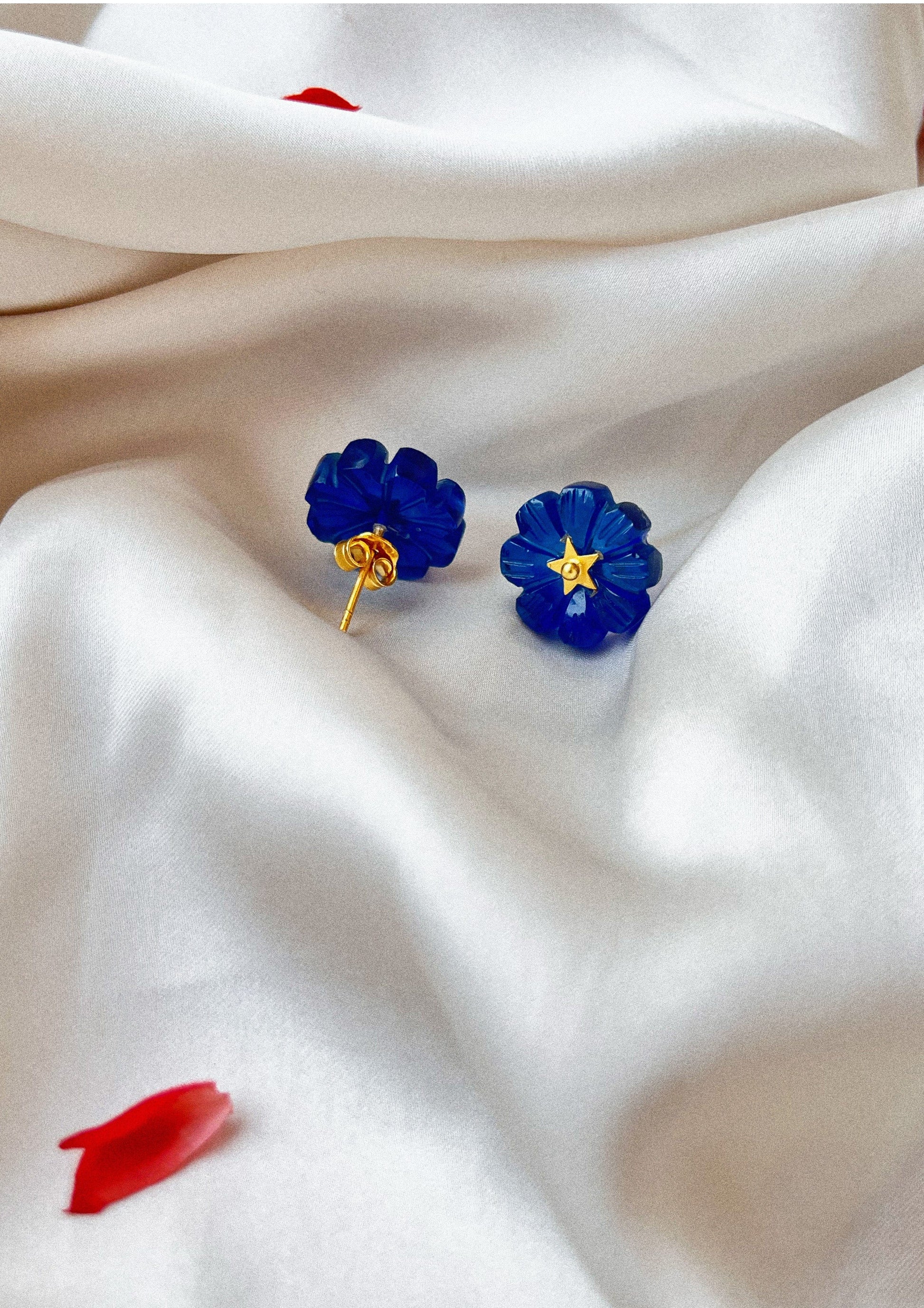 Blue quartz carved flower studs by The Raw India, delicate jewelry earrings featuring intricate floral design and vibrant gemstone.