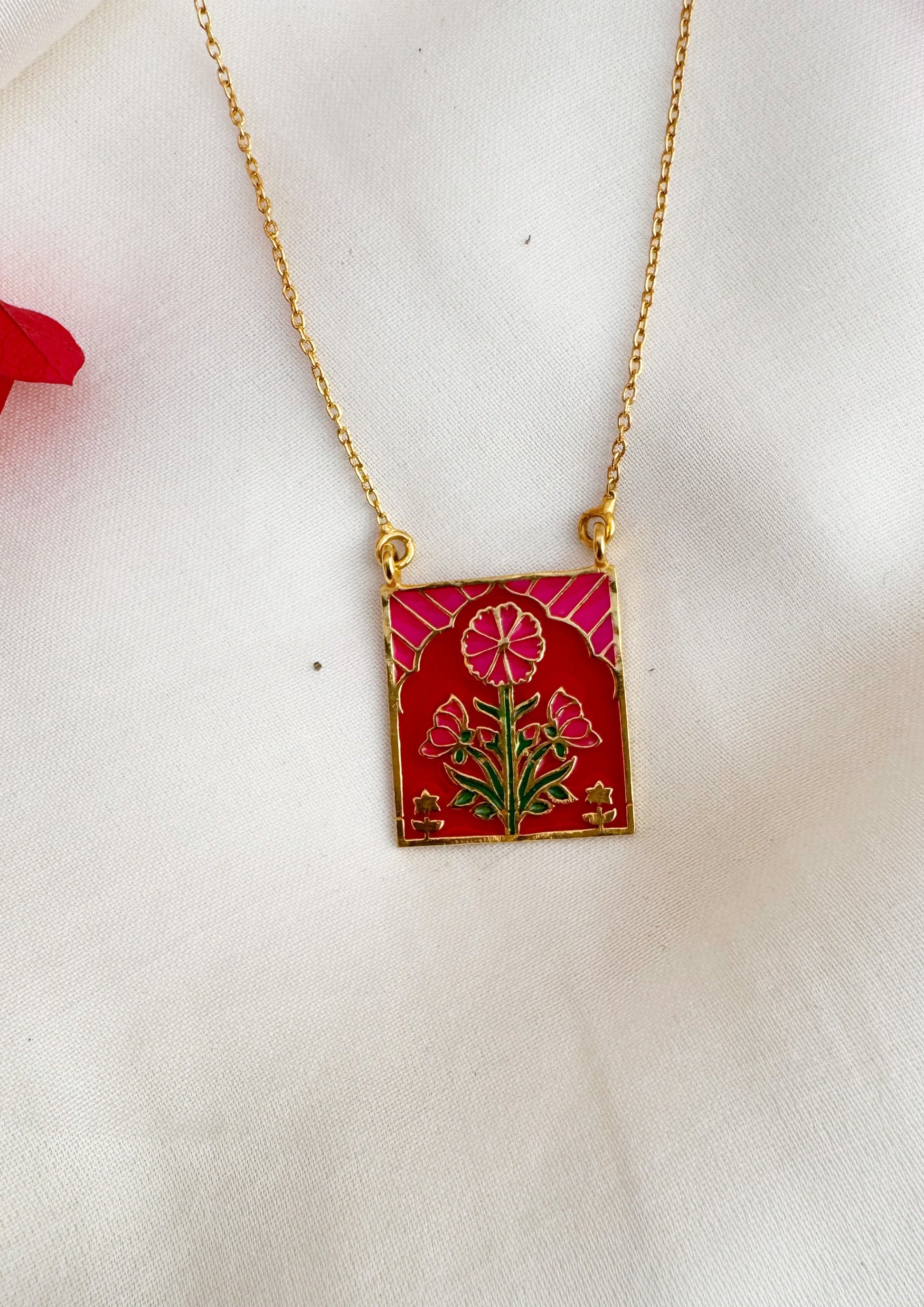 Pink Buta Meenakari pendant from The Raw India, showcasing intricate traditional jewellery design with vibrant enamel details.