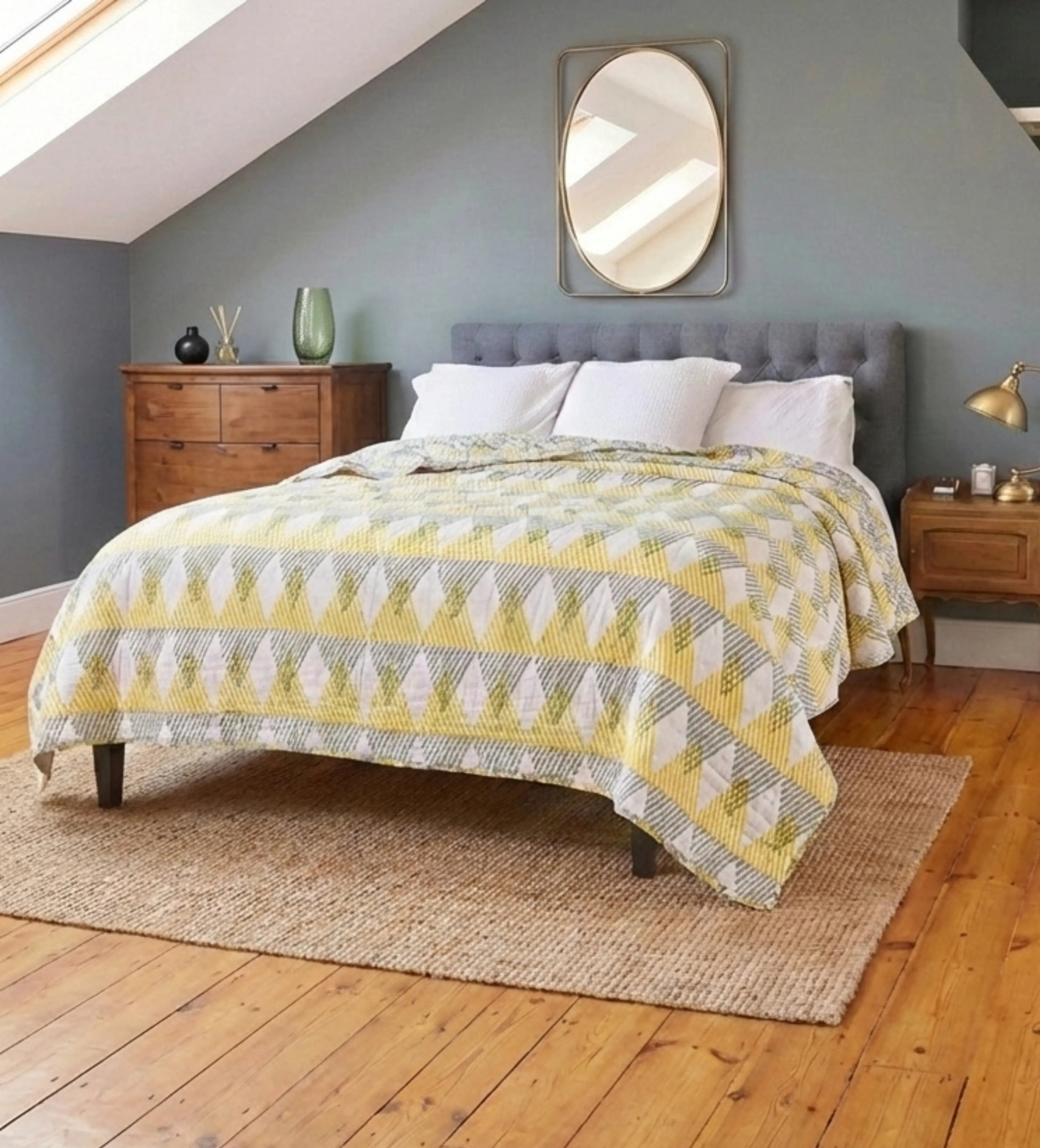 Reversible Sunnie chintz quilt by Bombaybirds with floral and geometric patterns, perfect for living room decor.
