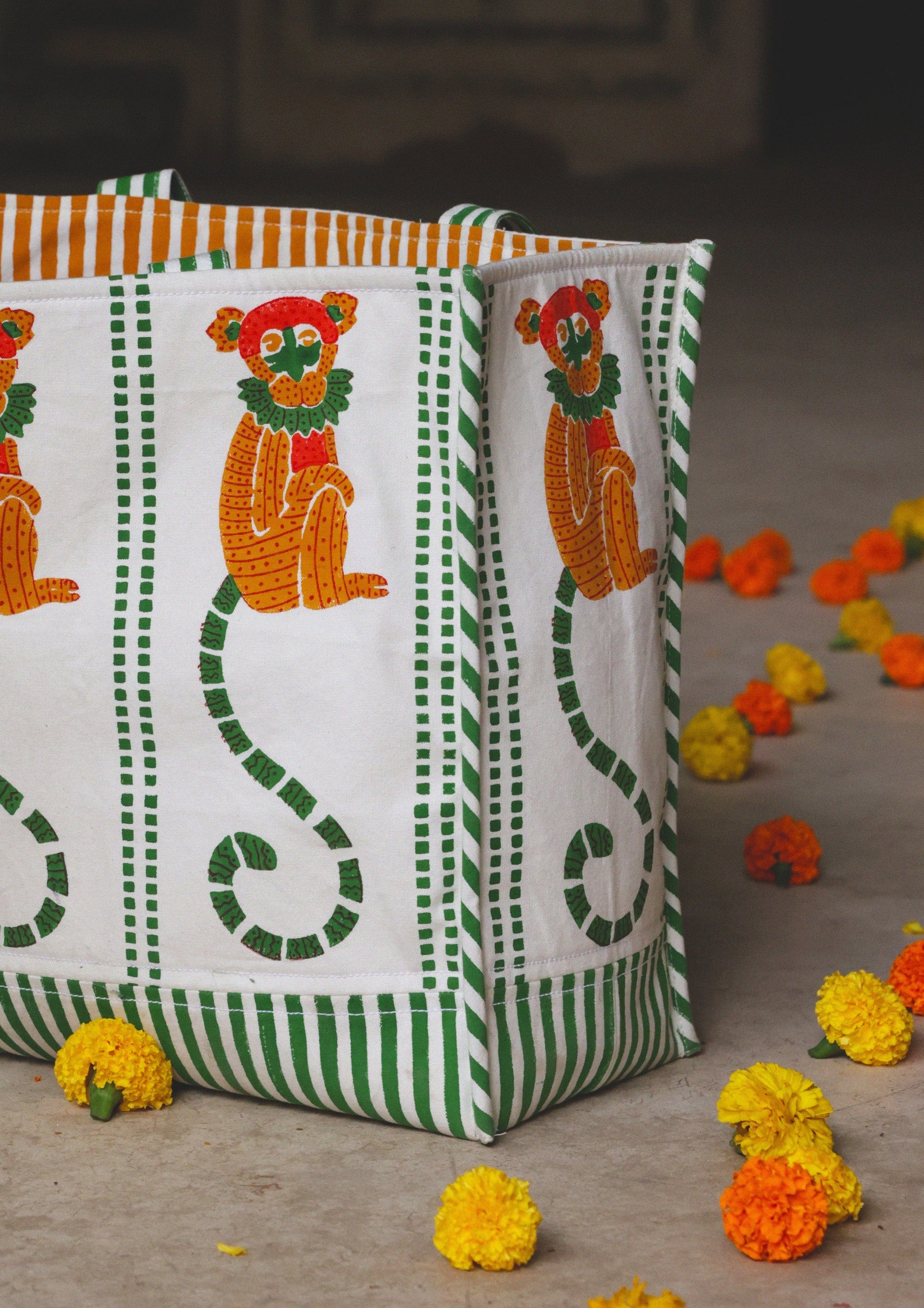 Colorful tote bag with monkey block print from The Raw India, featuring sturdy fabric and spacious interior for everyday use.