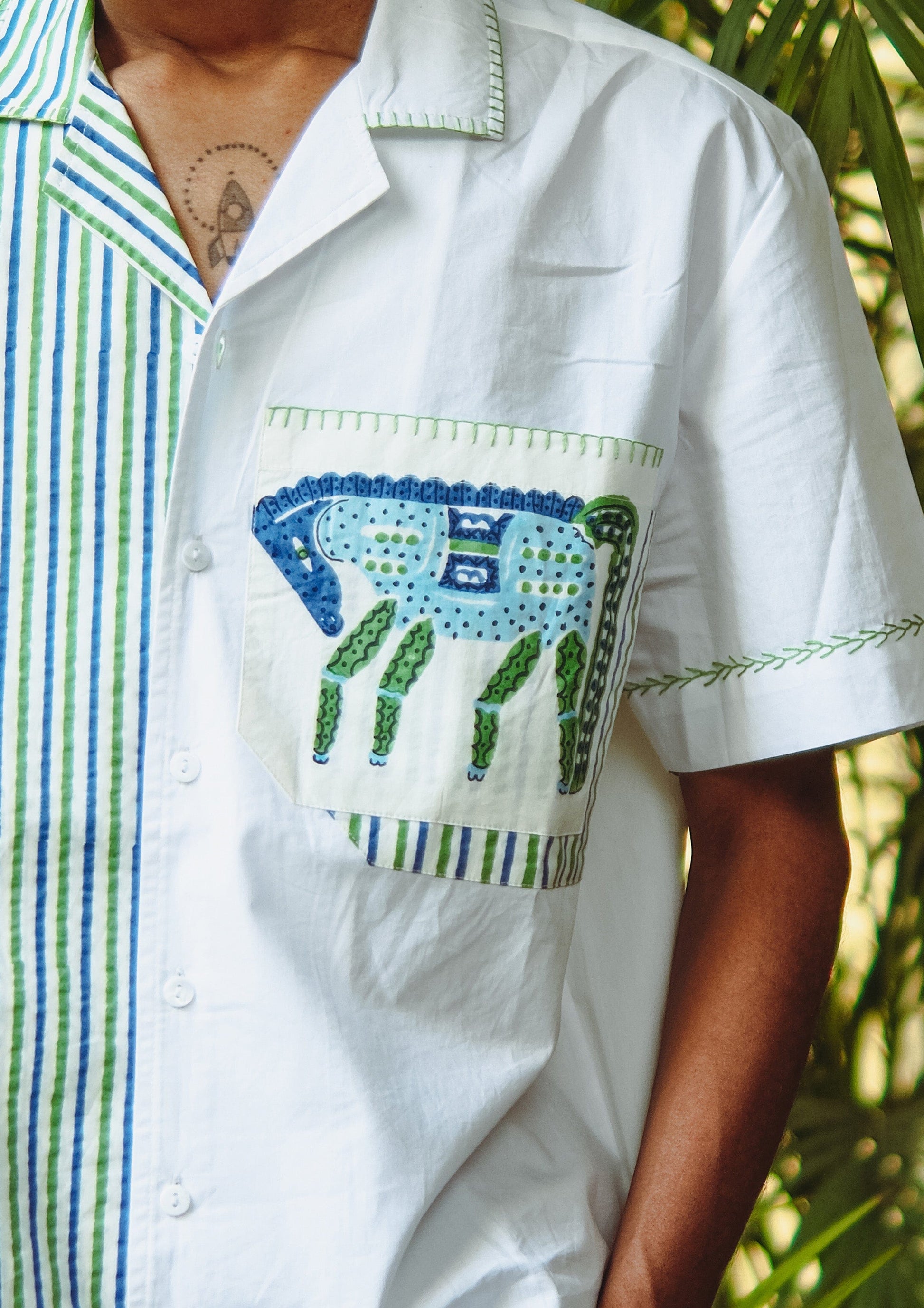 The Raw India Chetak shirt featuring a traditional Jodhpur horse design, displayed on a mannequin with intricate patterns and vibrant colors.