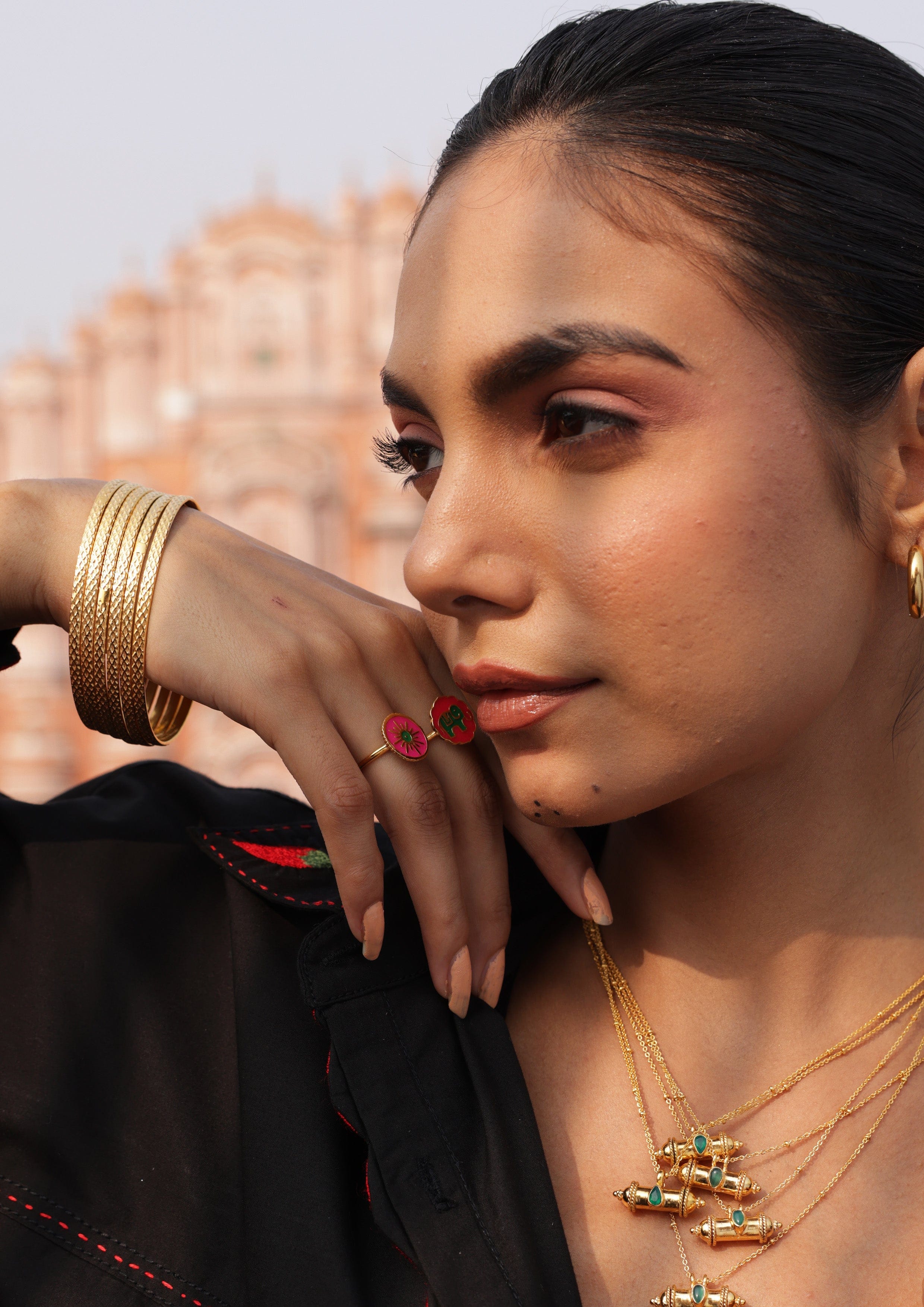 Sun meenakari ring from The Raw India jewelry featuring intricate enamel work and vibrant colors on a gold-tone band.