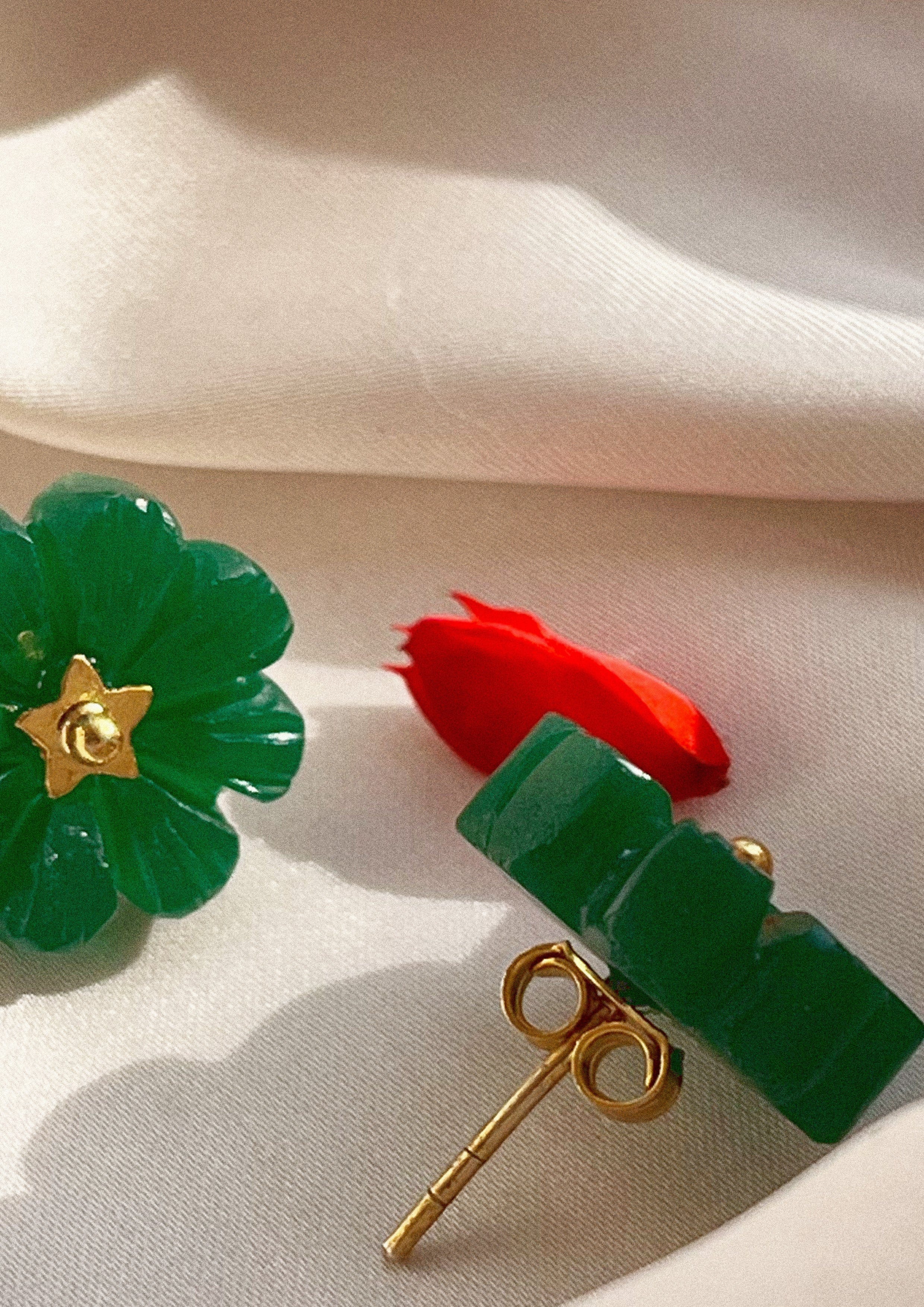Green onyx flower stud earrings from The Raw India, showcasing elegant jewelry with floral design and vibrant gemstone details.