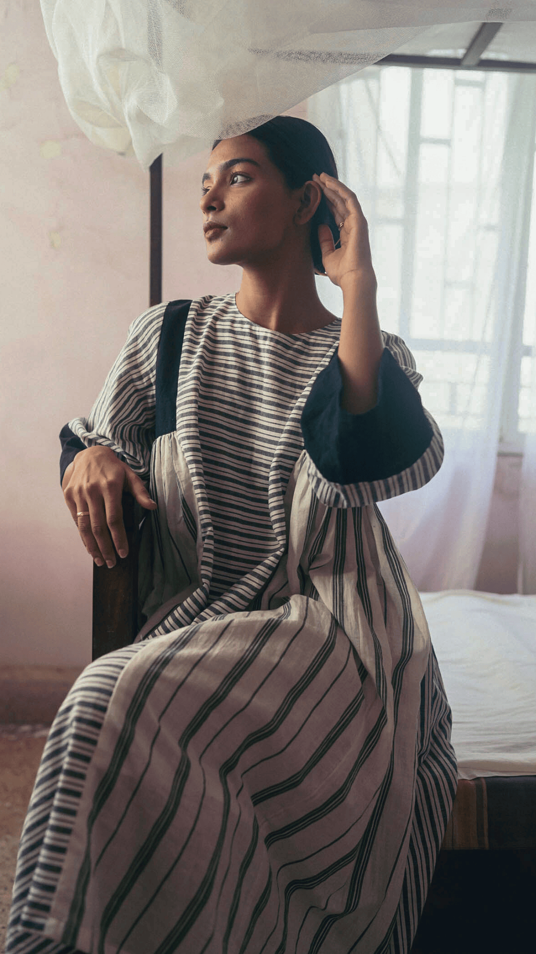 Deeta Shima dress displayed on a hanger, featuring a stylish design with vibrant colors and elegant fabric details.