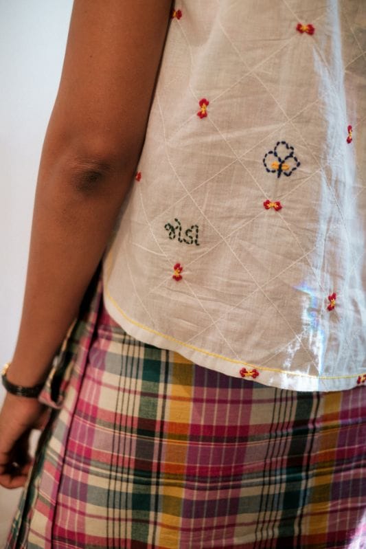 JODI Jaal Sadra top featuring intricate embroidery and lightweight fabric, displayed on a hanger.