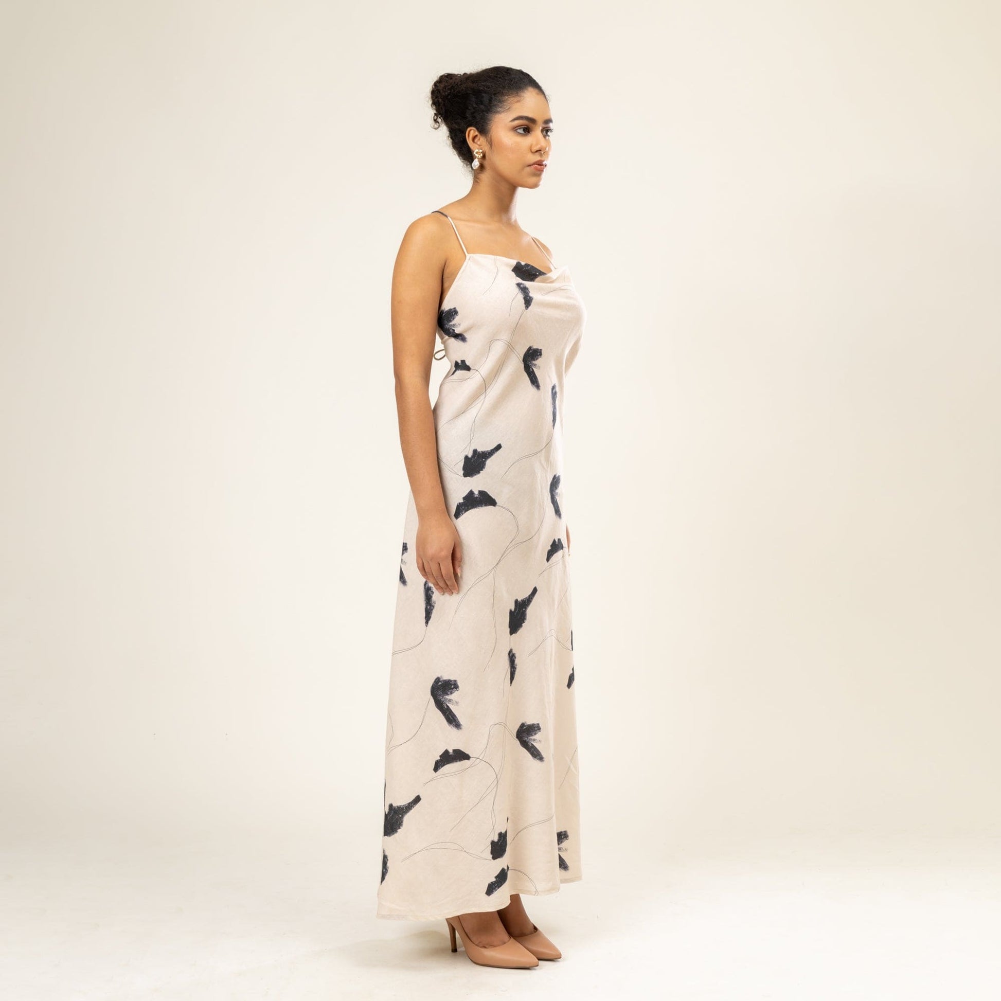 Doodlage Lola printed dress with colorful floral pattern, sleeveless design, and knee-length cut on a mannequin.