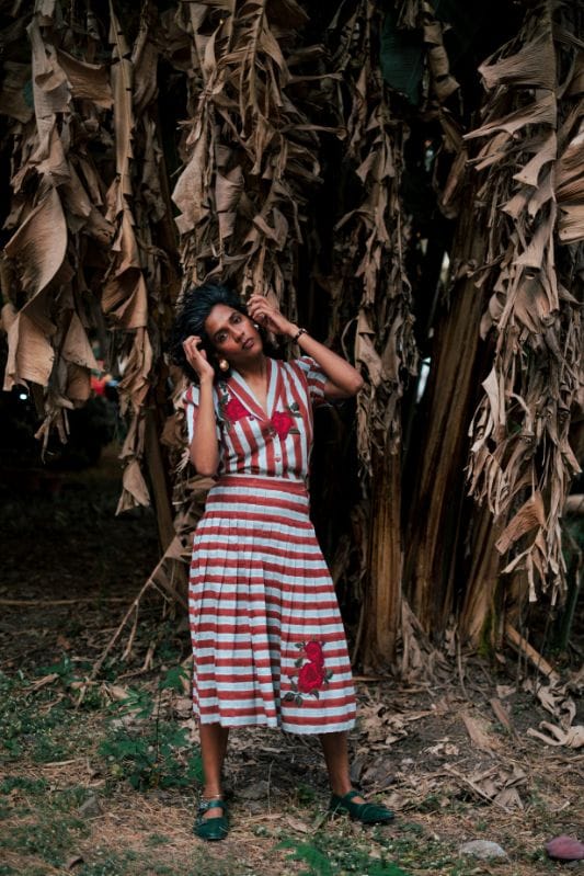 JODI Doriya pleated skirt in soft fabric with elegant pleats, styled on a model for a chic, fashionable look.
