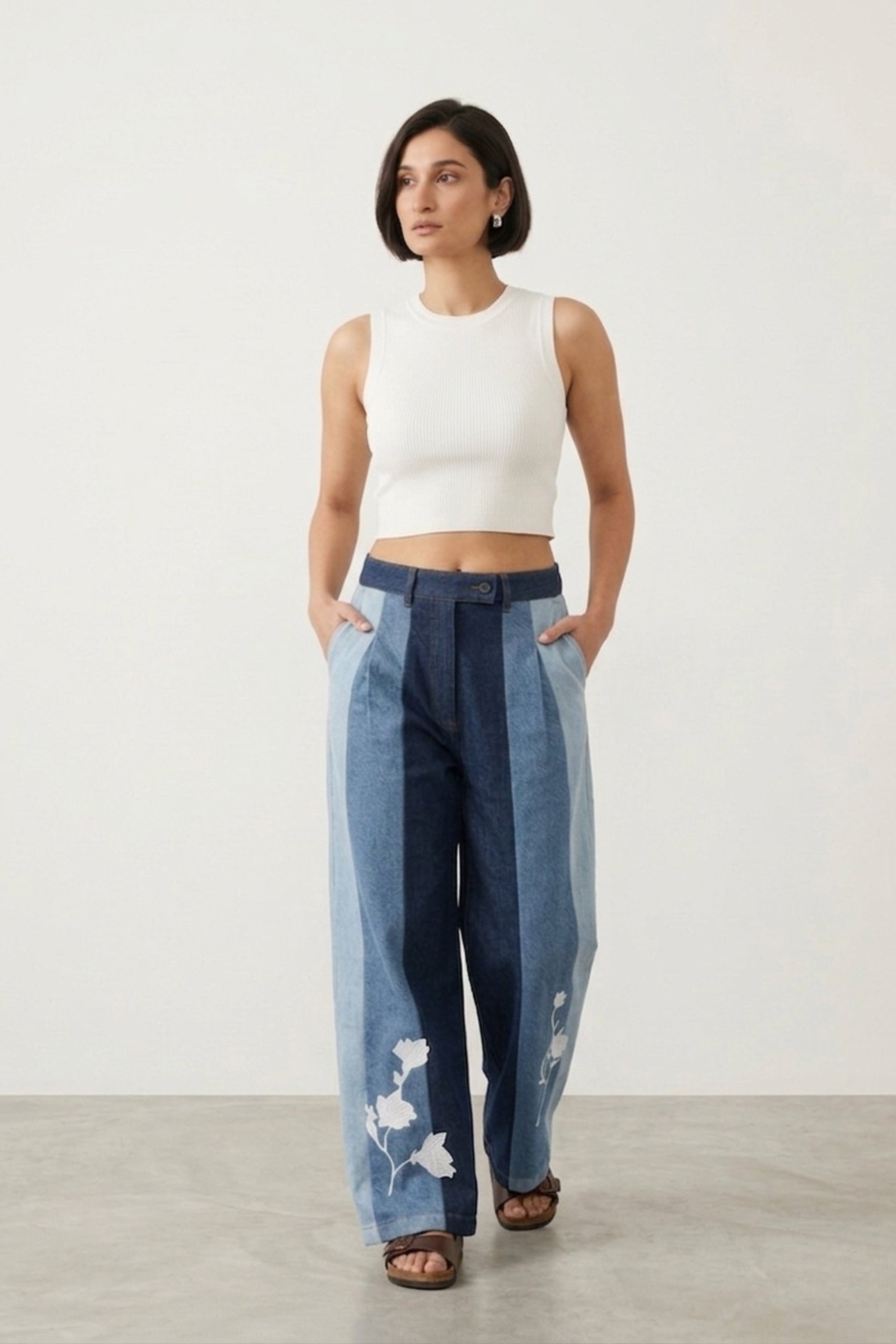 Doodlage Ember denim panelled pants with mixed denim panels and relaxed fit, shown on a model.