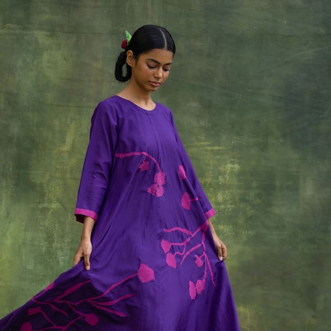 Doodlage Jill embroidered dress featuring intricate embroidery and a flowing silhouette, displayed on a hanger.