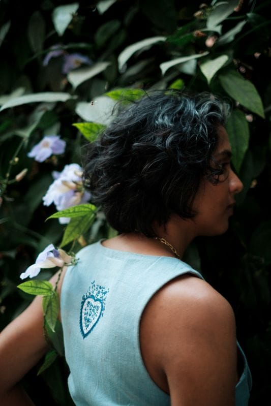 Handloom denim waistcoat by JODI, traditional koti style, featuring woven denim fabric and intricate detailing.