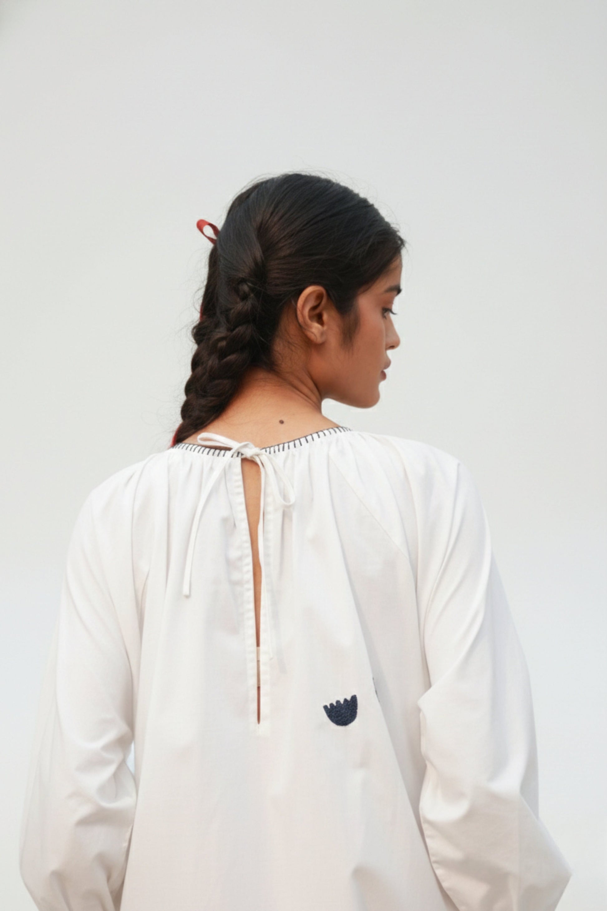 Astrid white Doodlage dress with a flowing design, lightweight fabric, and subtle detailing, perfect for casual or semi-formal wear.