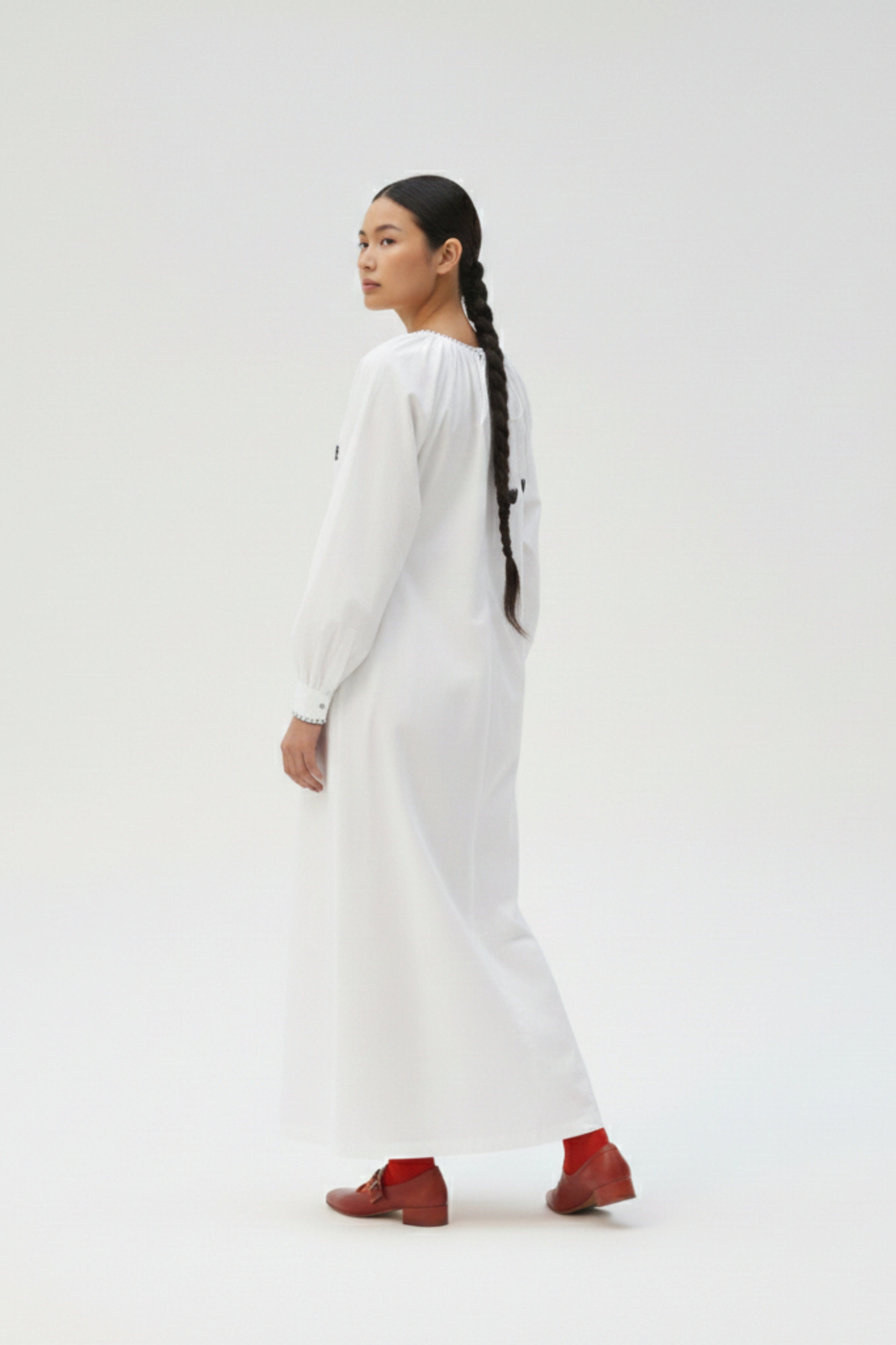 White Astrid dress by Doodlage featuring a flowy silhouette and subtle detailing, perfect for casual or semi-formal wear.